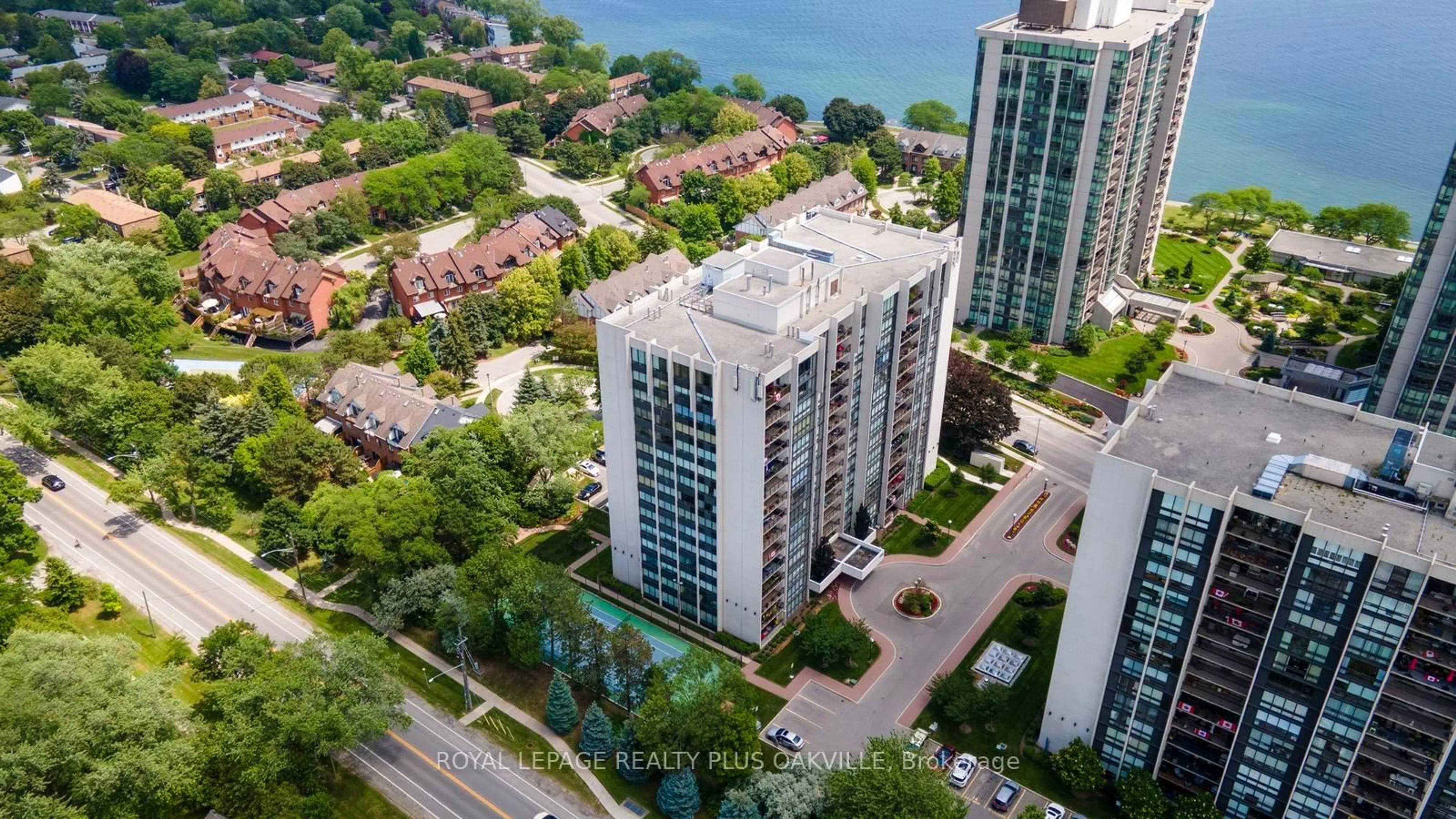 A pic from outside/outdoor area/front of a property/back of a property/a pic from drone, city buildings view from balcony for 2175 Marine Dr #102, Oakville Ontario L6L 5L5