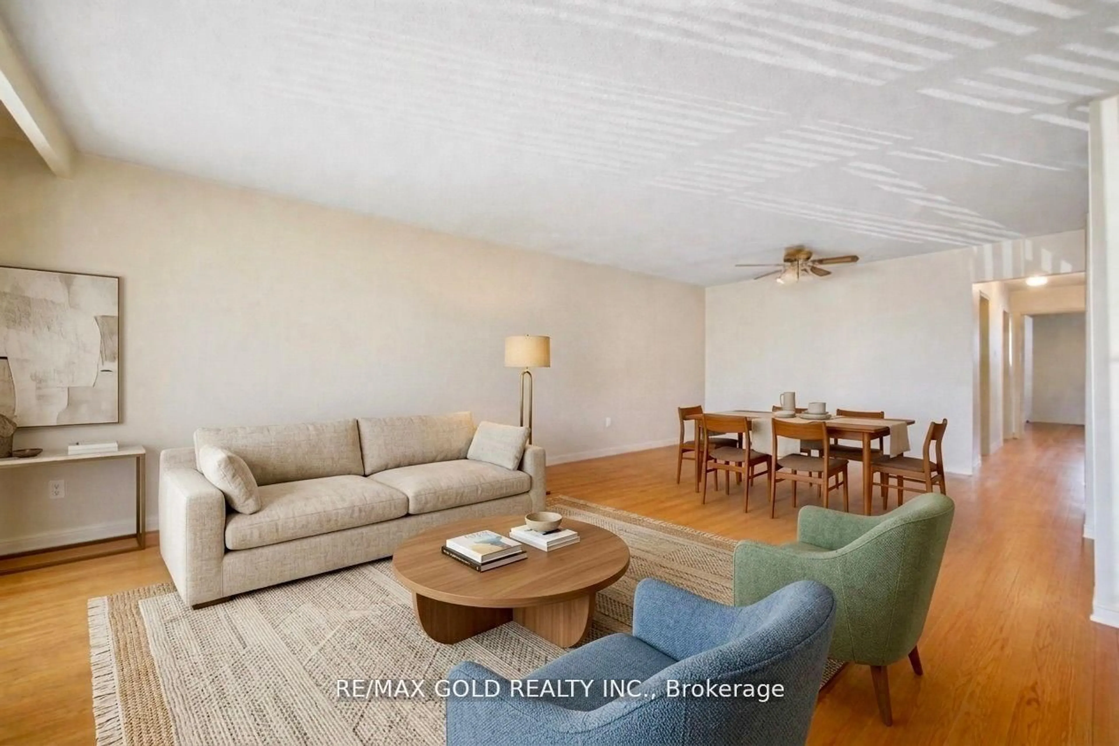Living room with furniture, wood/laminate floor for 877 Consort Cres, Mississauga Ontario L5C 1J8