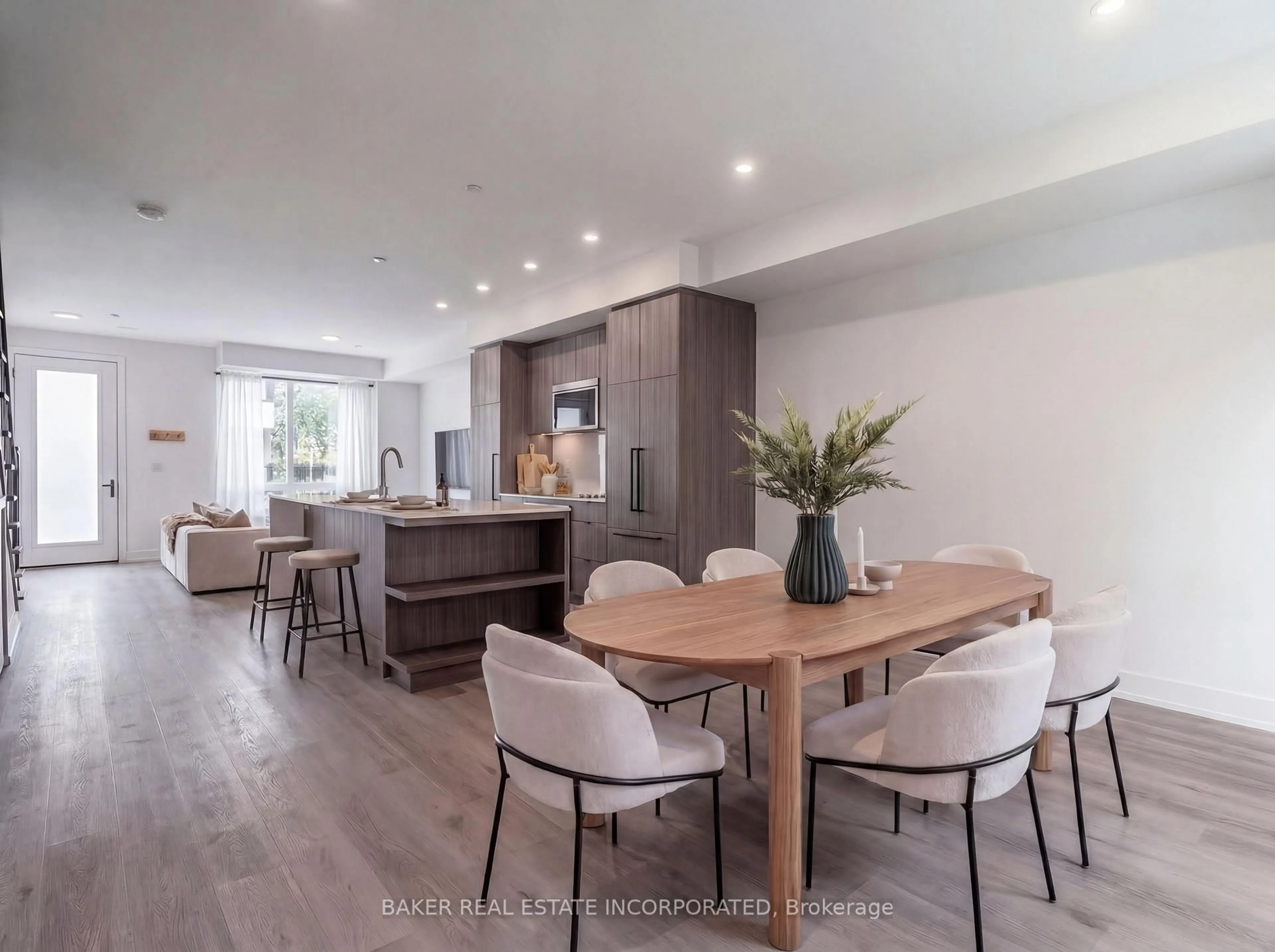 Open concept kitchen, wood/laminate floor for 251 Masonry Way #102, Mississauga Ontario L5H 0B3