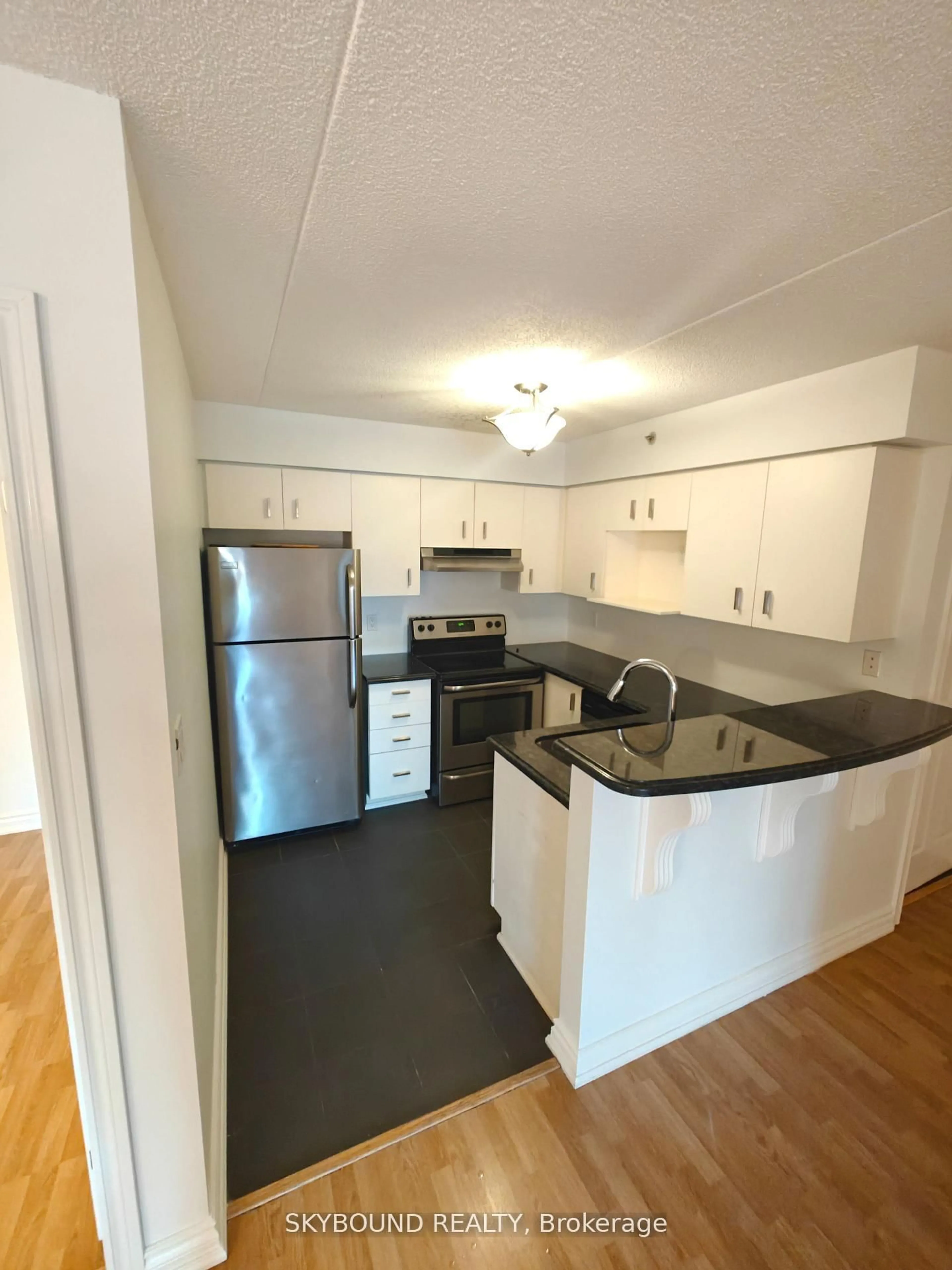 Standard kitchen, wood/laminate floor for 1800 Walkers Line #206, Burlington Ontario L7M 4V2