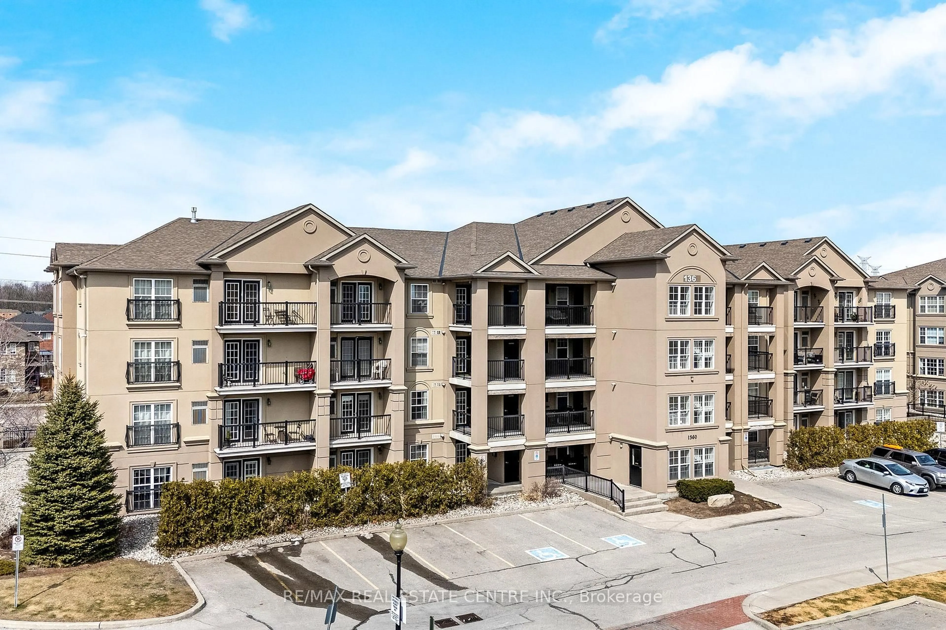 A pic from outside/outdoor area/front of a property/back of a property/a pic from drone, unknown for 1360 Main St #304, Milton Ontario L9T 7S5