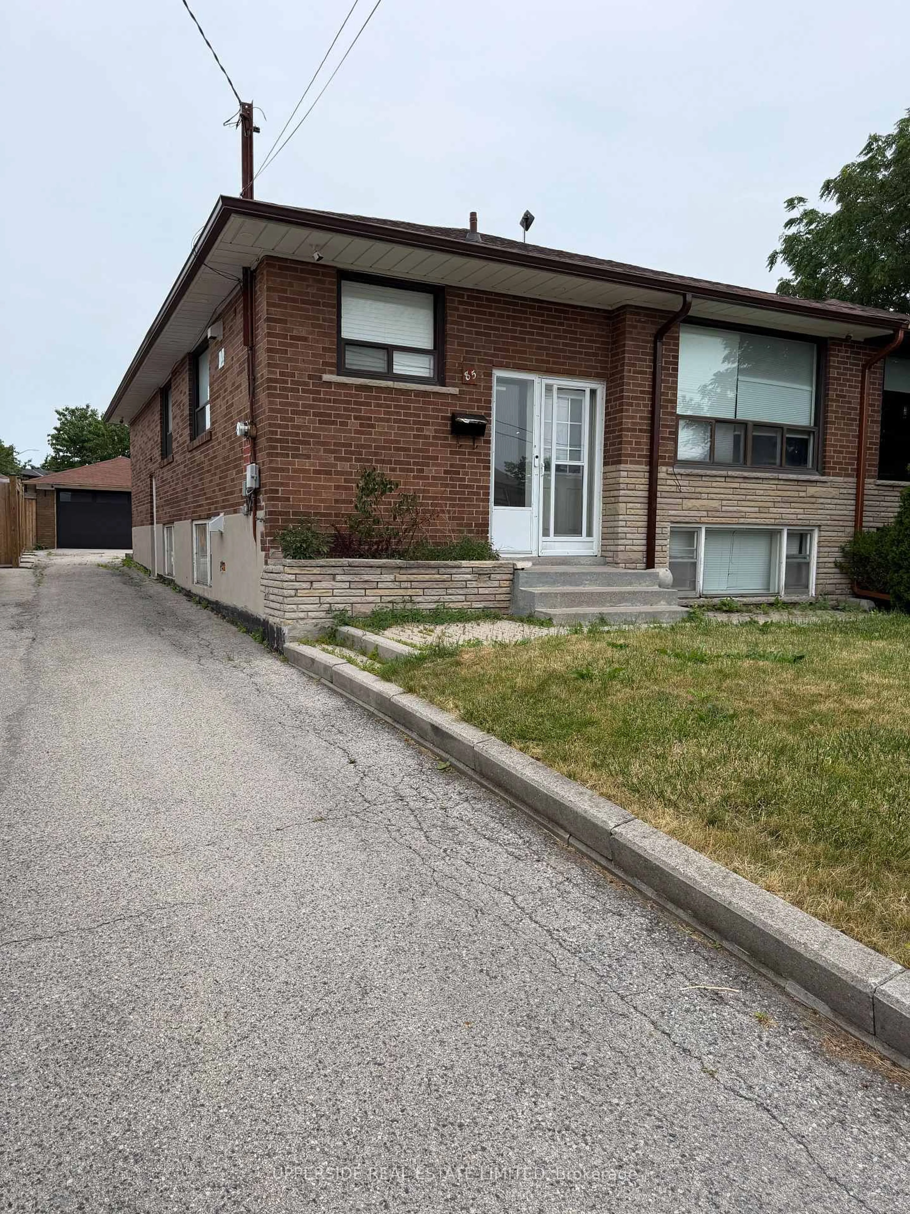 Home with brick exterior material, street for 85 Mulholland Ave, Toronto Ontario M6A 2S5