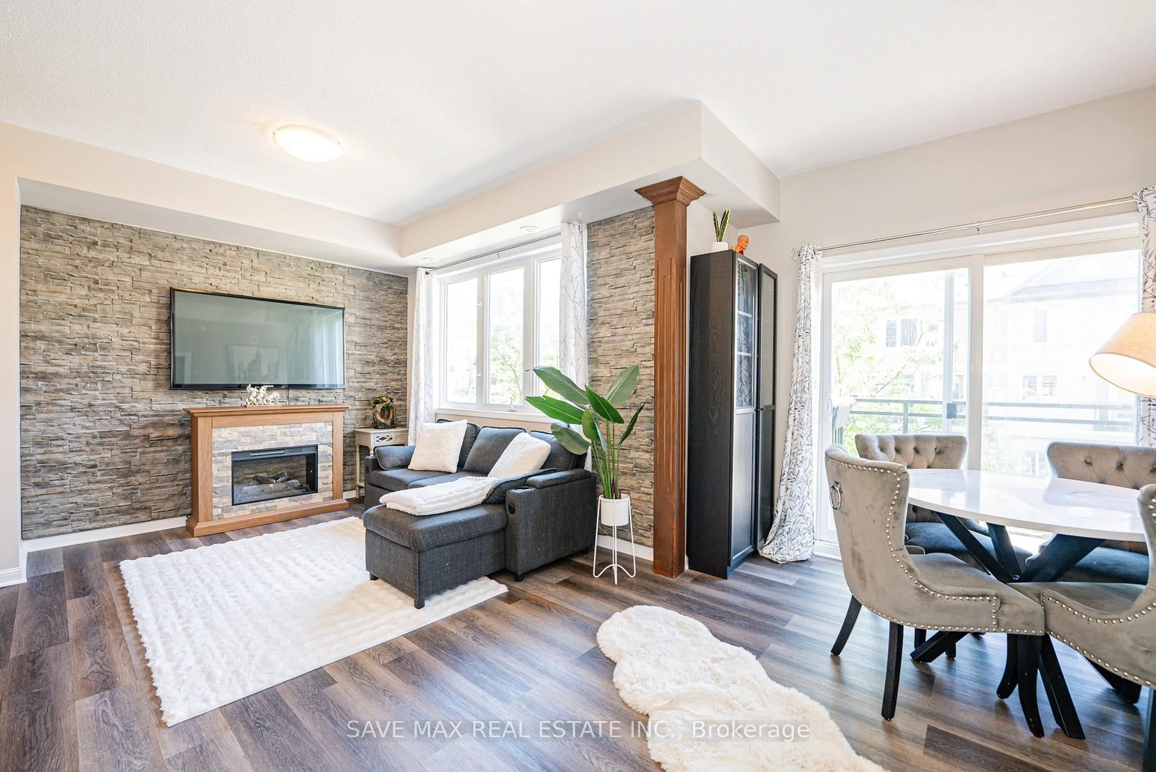 Living room with furniture, wood/laminate floor for 3075 THOMAS St #213, Mississauga Ontario L5M 0L8