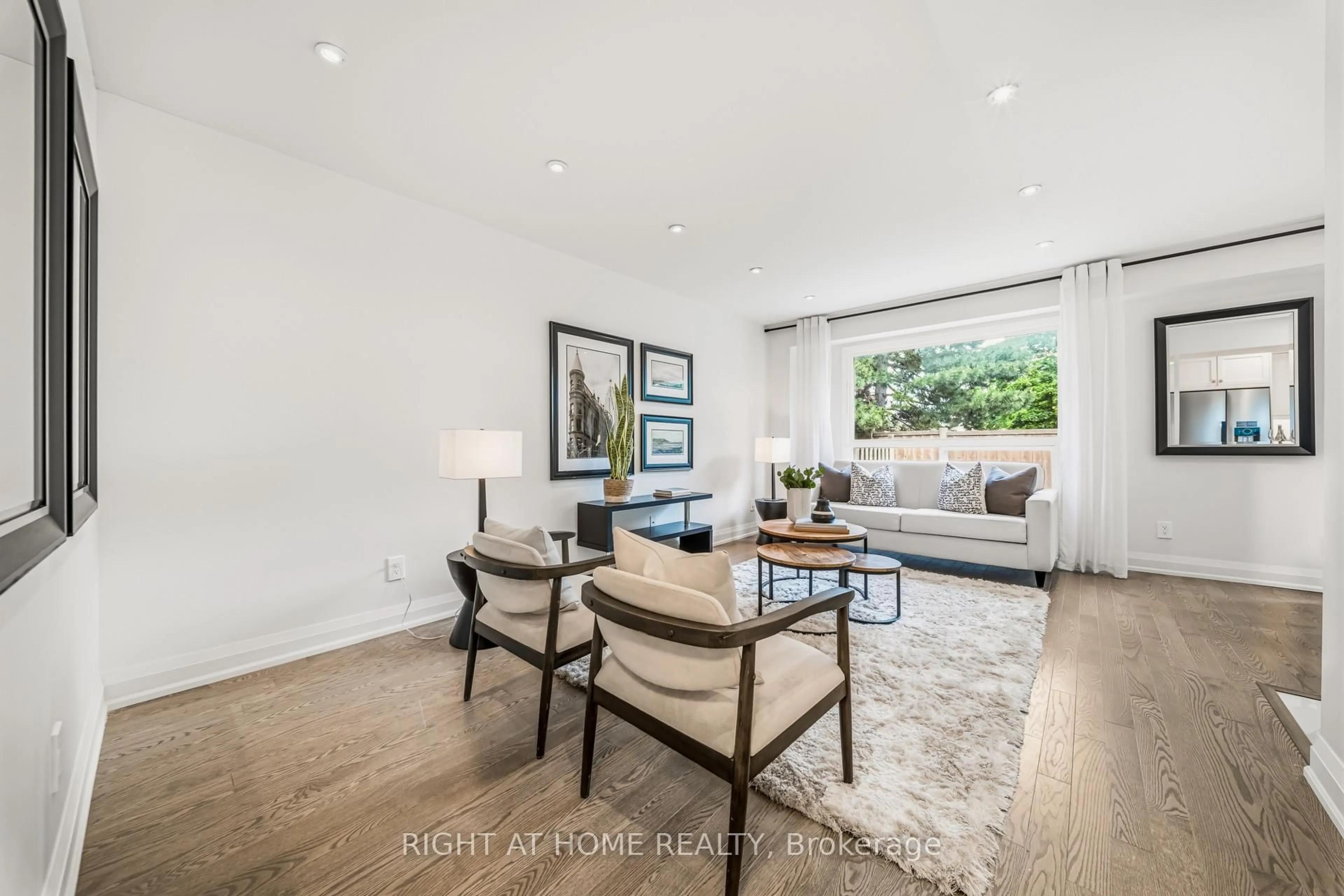 Living room with furniture, wood/laminate floor for 3079 Fifth Line #19, Mississauga Ontario L5L 3T1