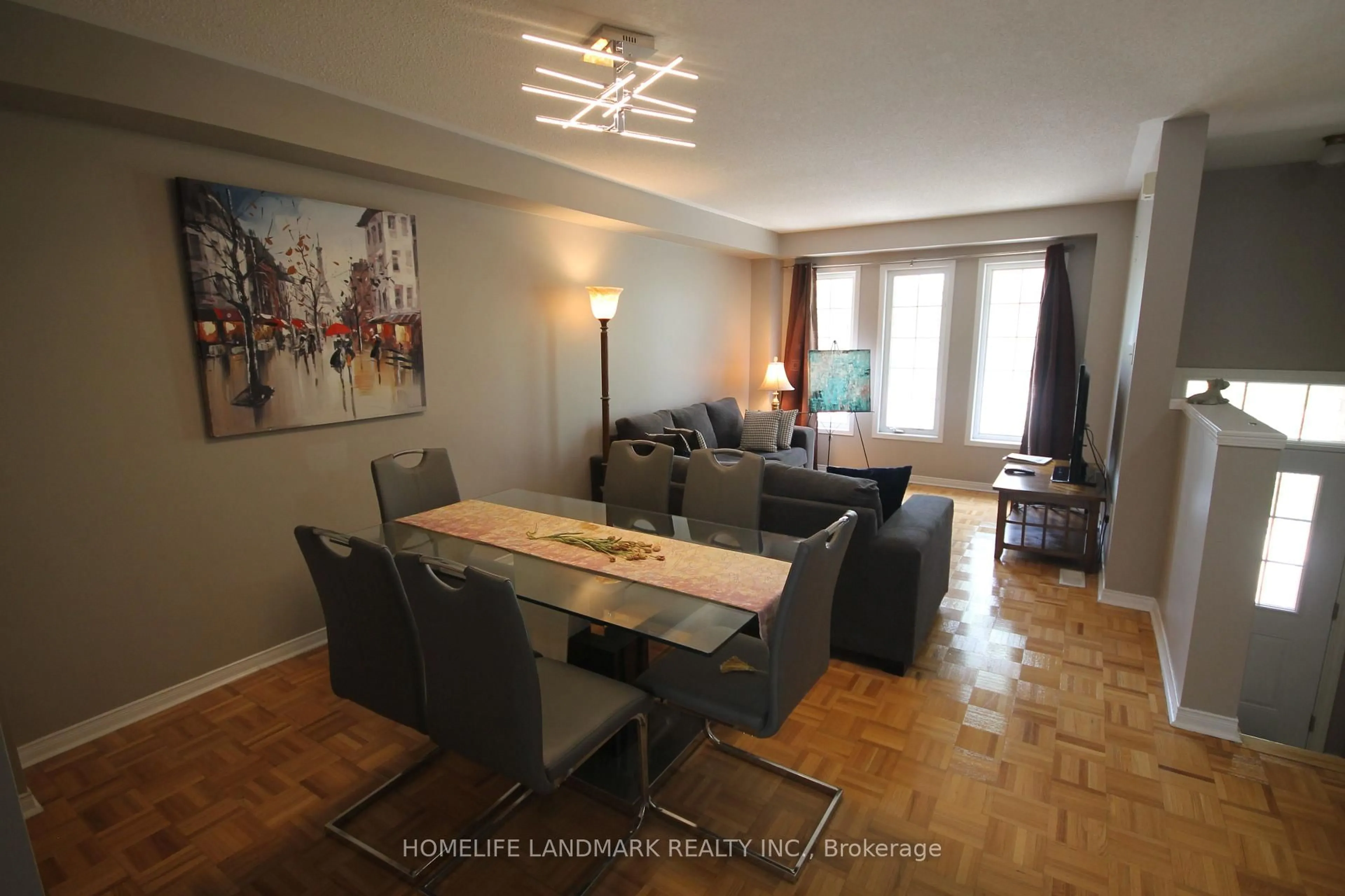 Living room with furniture, wood/laminate floor for 4950 Albina Way #28, Mississauga Ontario L4Z 4J4