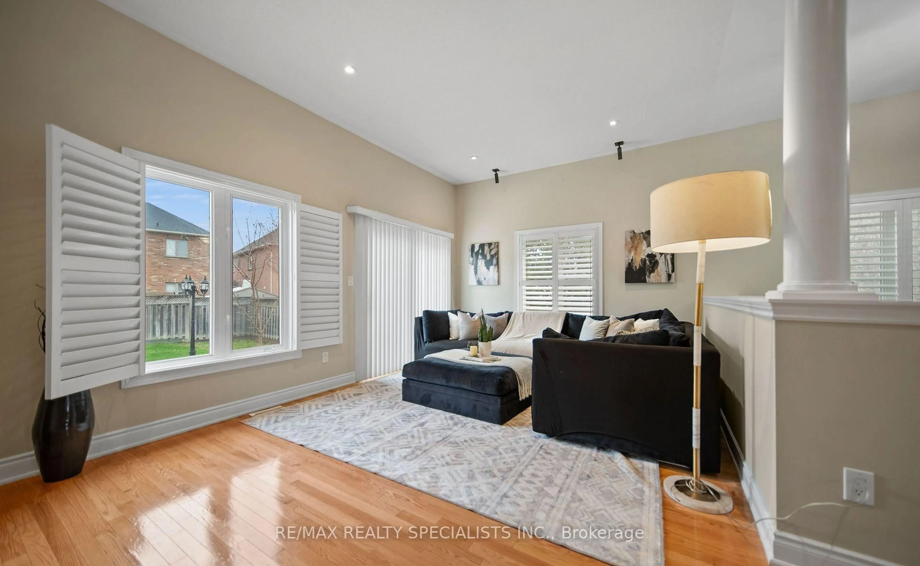 Living room with furniture, wood/laminate floor for 31 Saint Hubert Dr, Brampton Ontario L6P 1W1