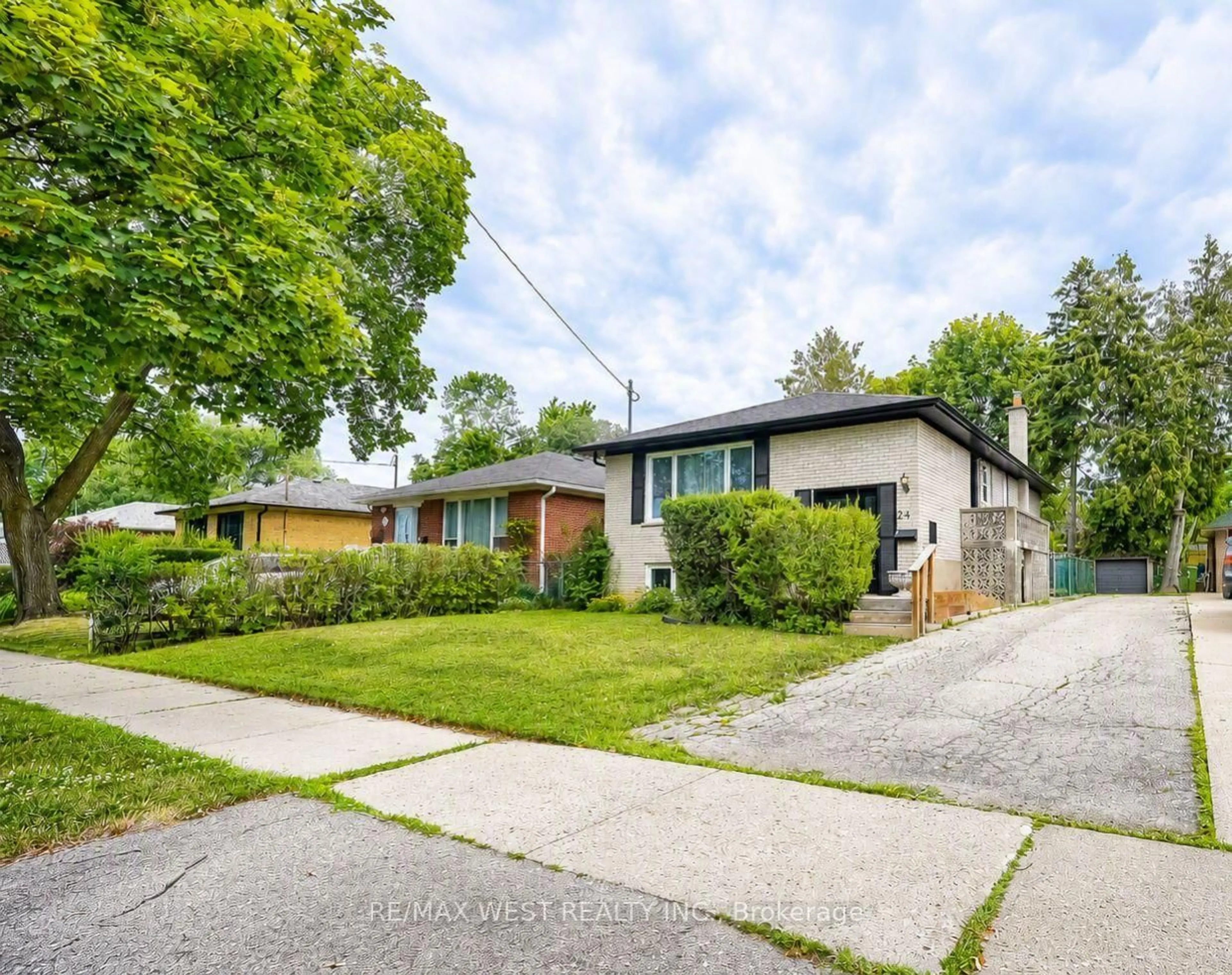 Home with brick exterior material, street for 24 Waxham Rd, Toronto Ontario M9W 3L3