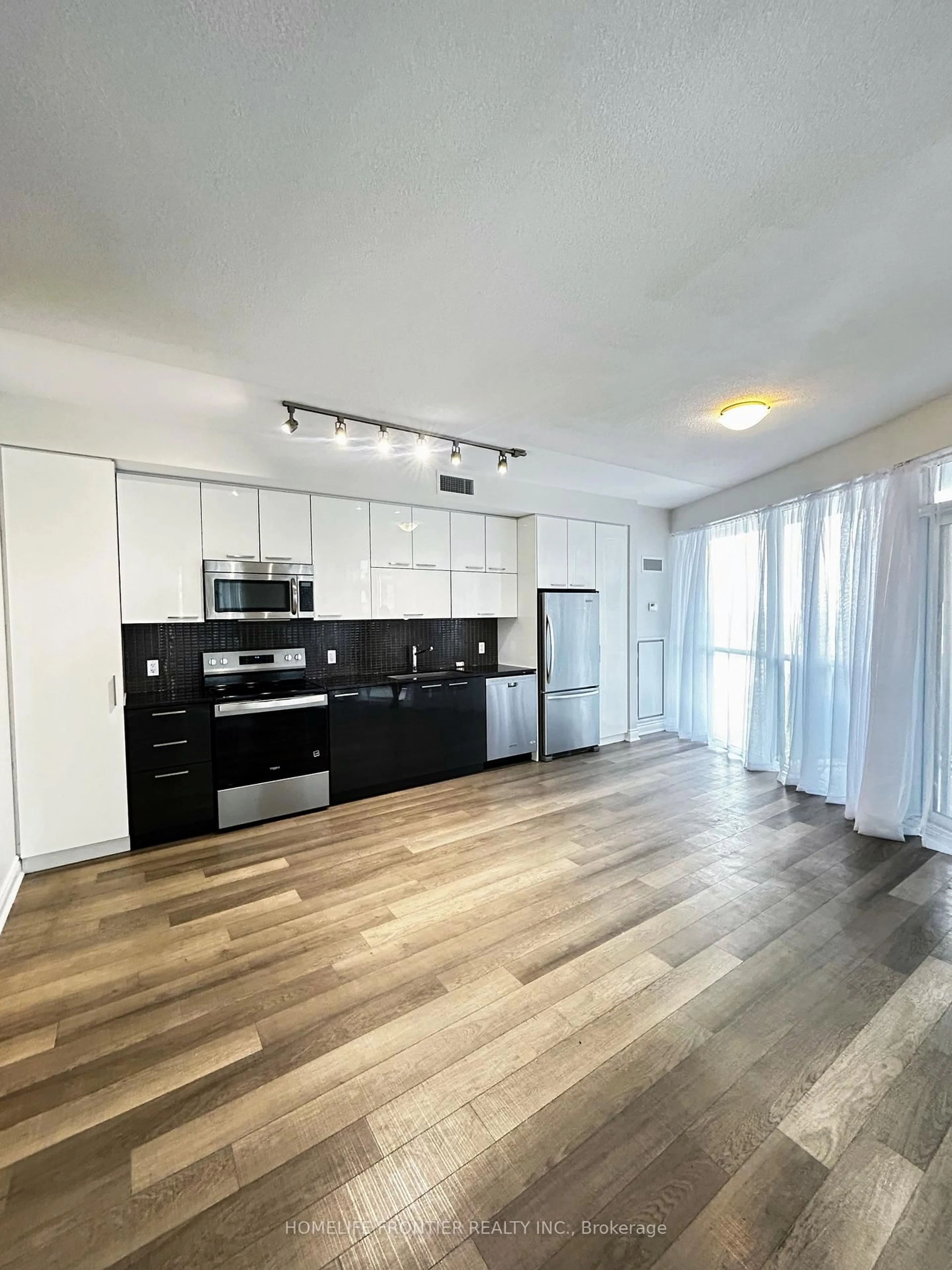 Open concept kitchen, wood/laminate floor for 80 Marine Parade Dr #606, Toronto Ontario M8V 0A3