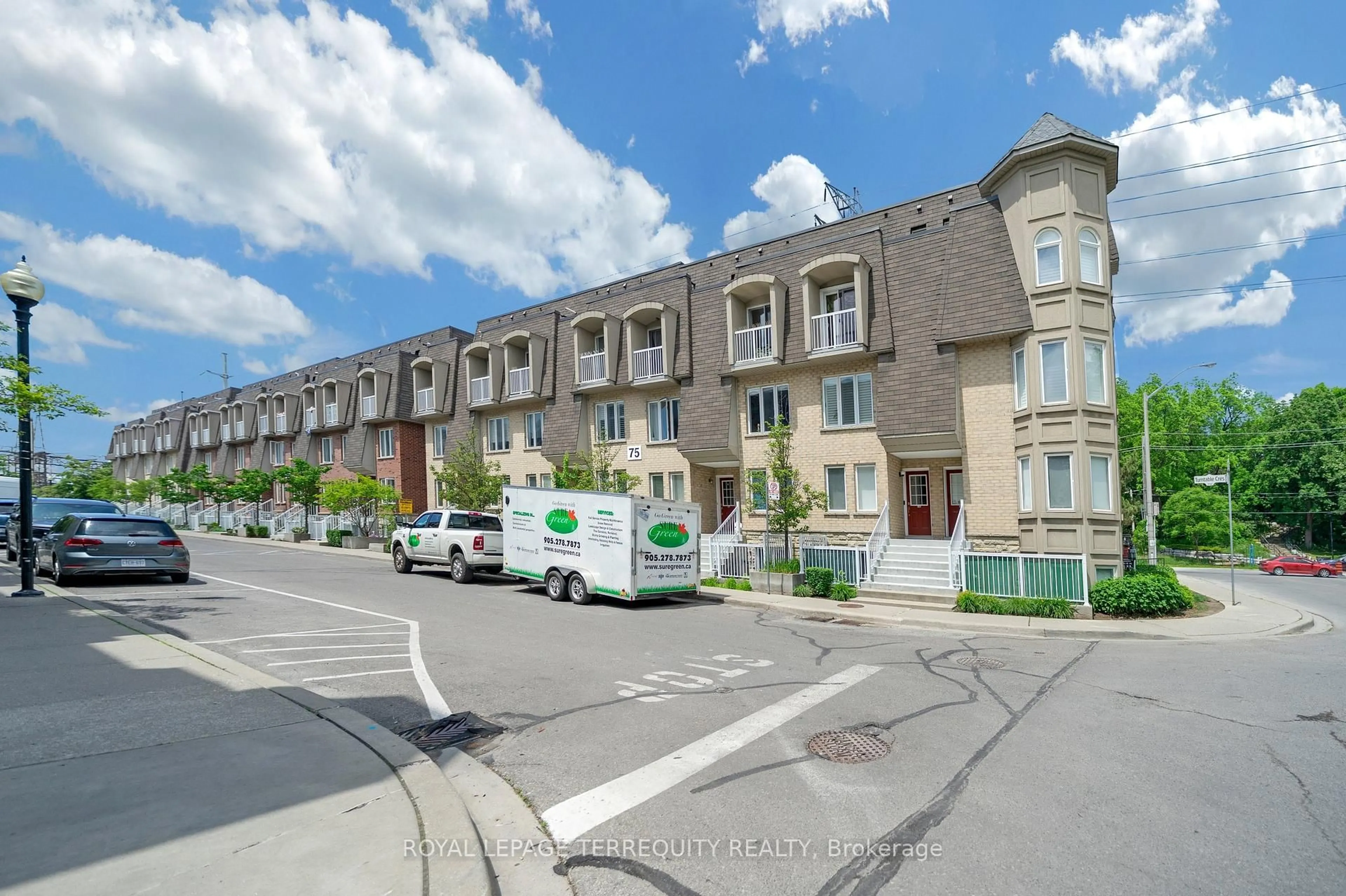A pic from outside/outdoor area/front of a property/back of a property/a pic from drone, street for 75 Turntable Cres #124, Toronto Ontario M6H 4K9