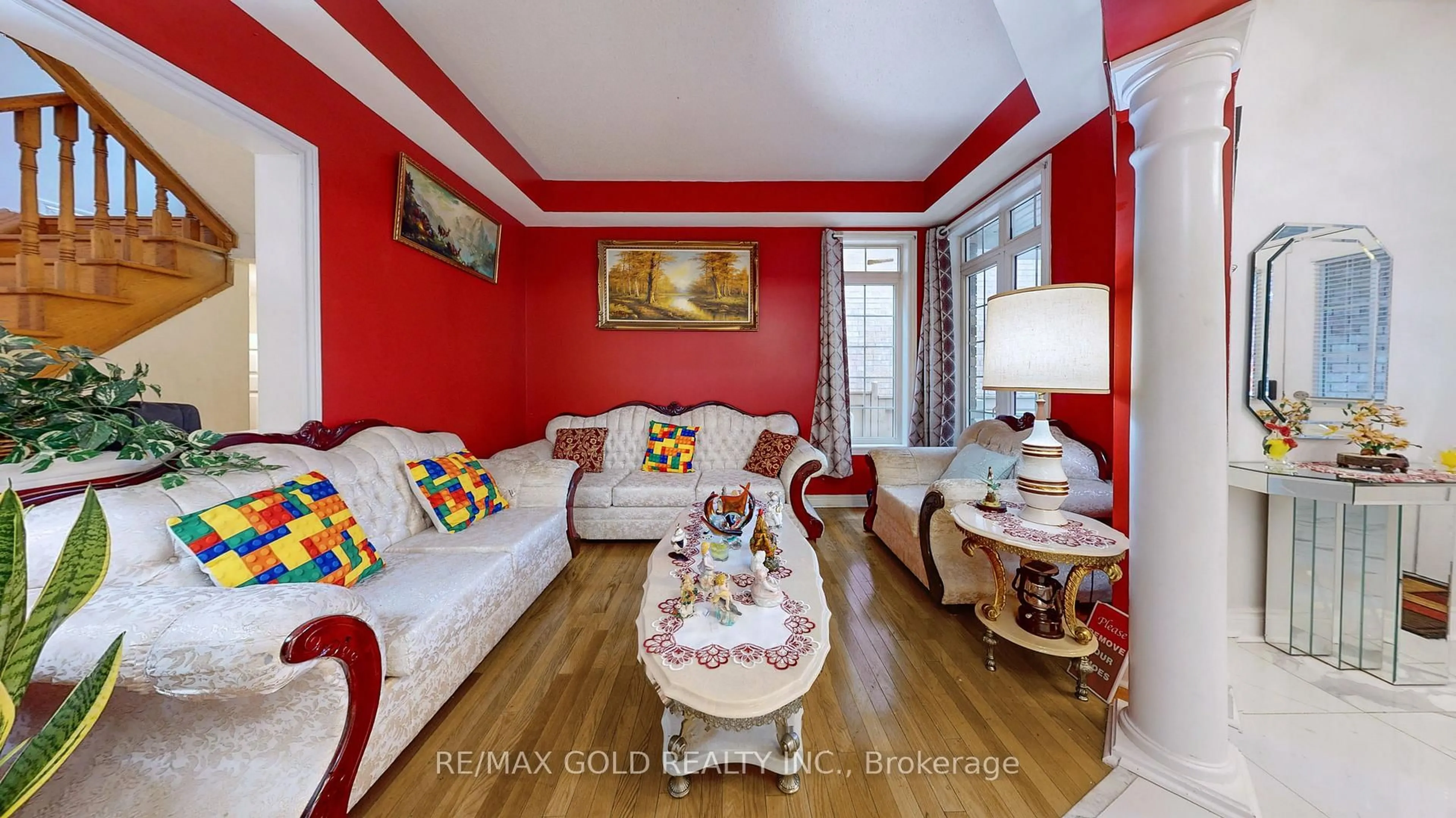 Living room with furniture, wood/laminate floor for 64 Prue Crt, Brampton Ontario L6P 1P8