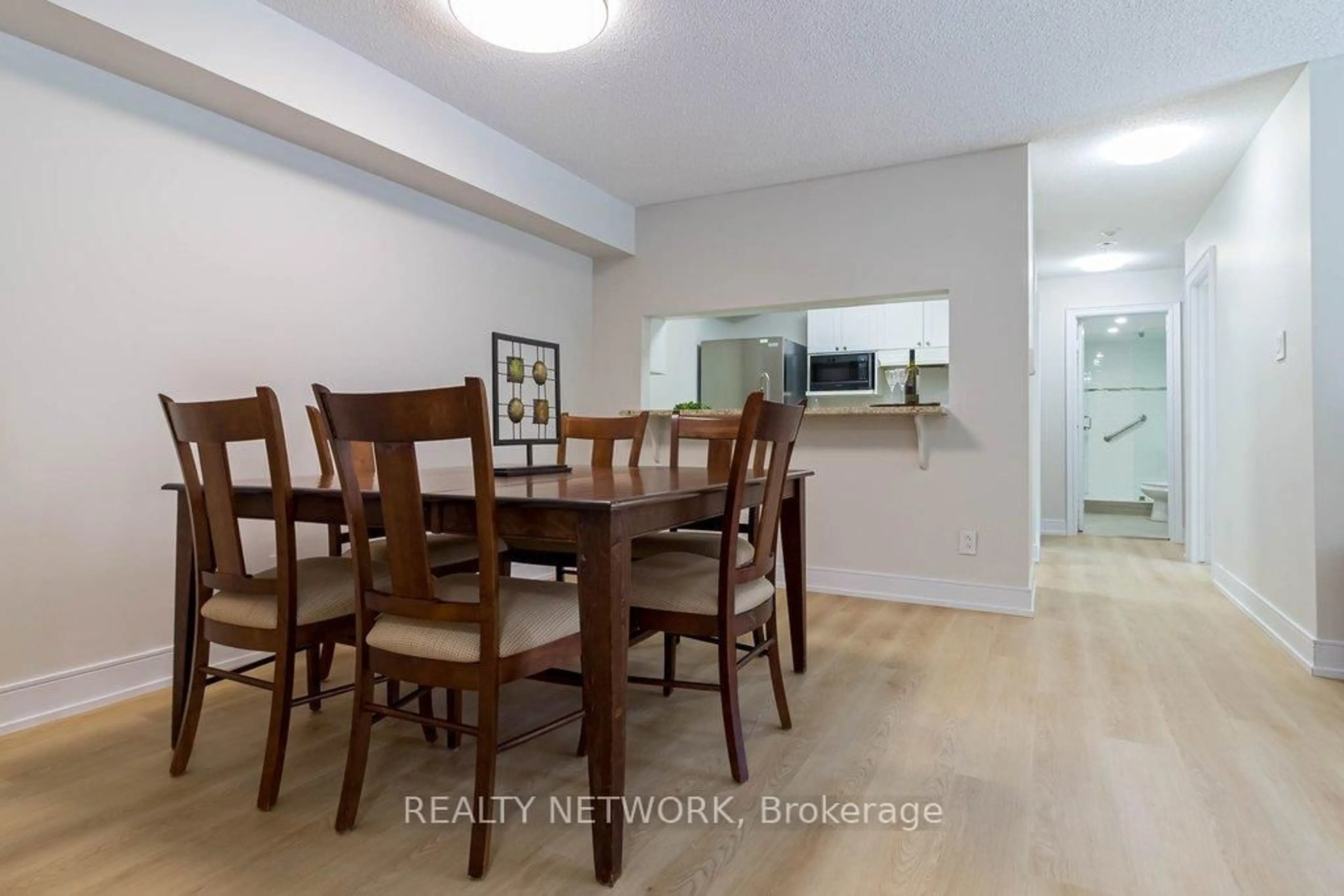 Dining room, wood/laminate floor for 1450 Glen Abbey Gate #913, Oakville Ontario L6M 2V7