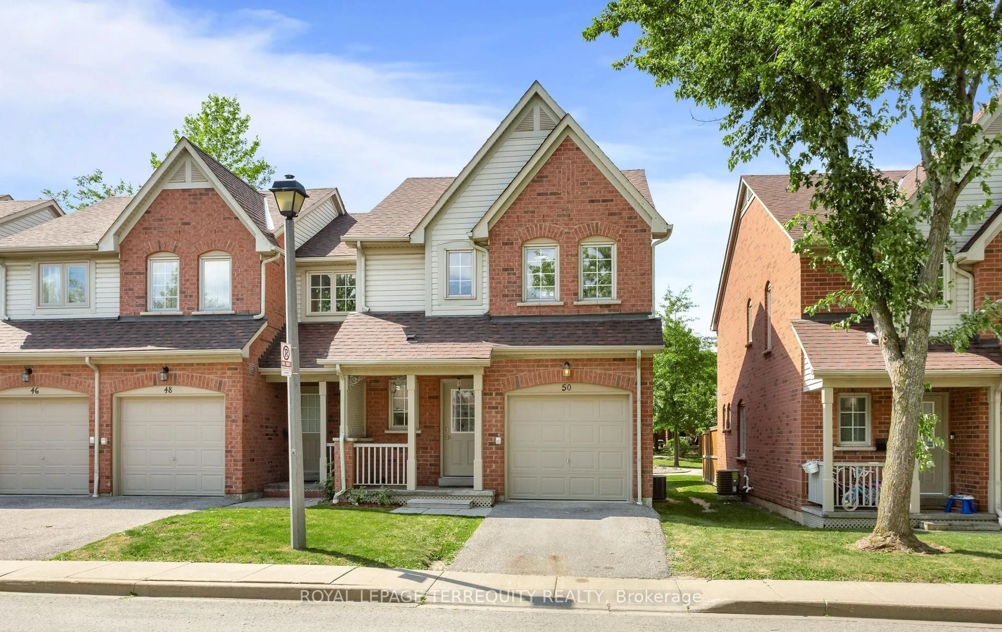 Home with brick exterior material, street for 5950 Glen Erin Dr #50, Mississauga Ontario L5M 6J1