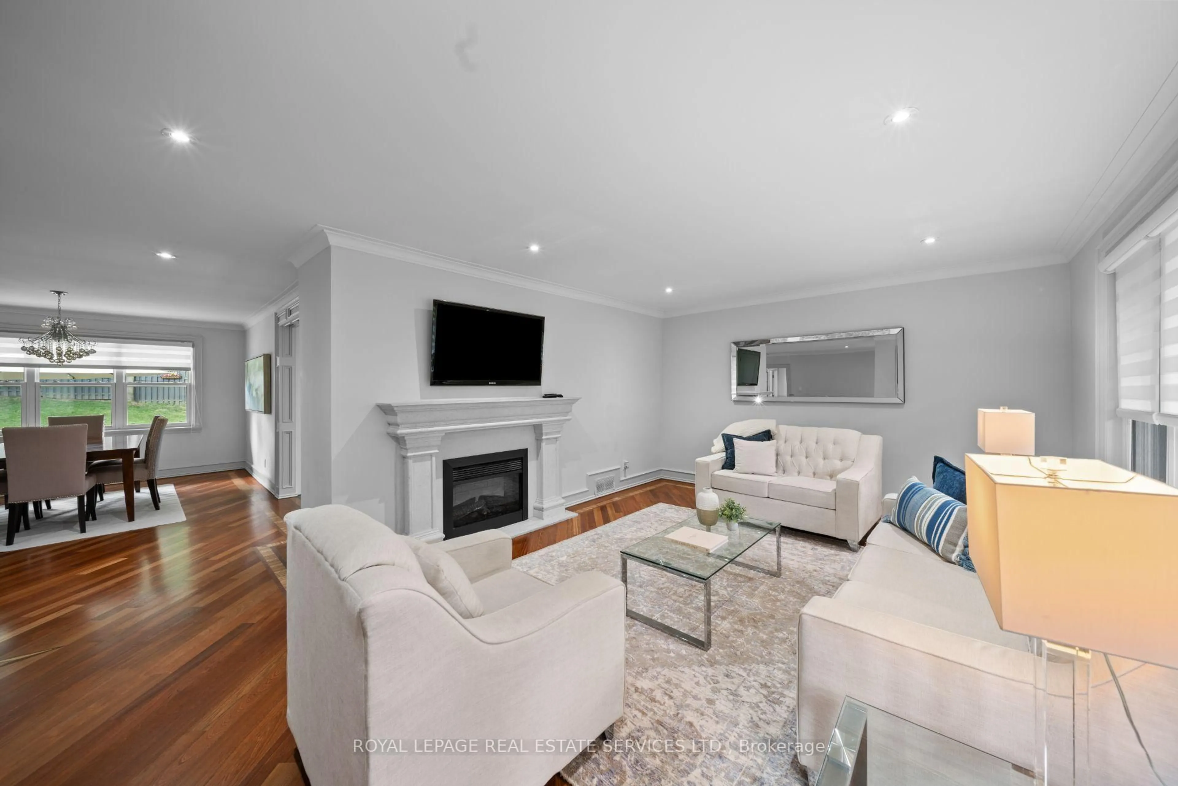Living room with furniture, wood/laminate floor for 1592 Islington Ave, Toronto Ontario M9A 3M6