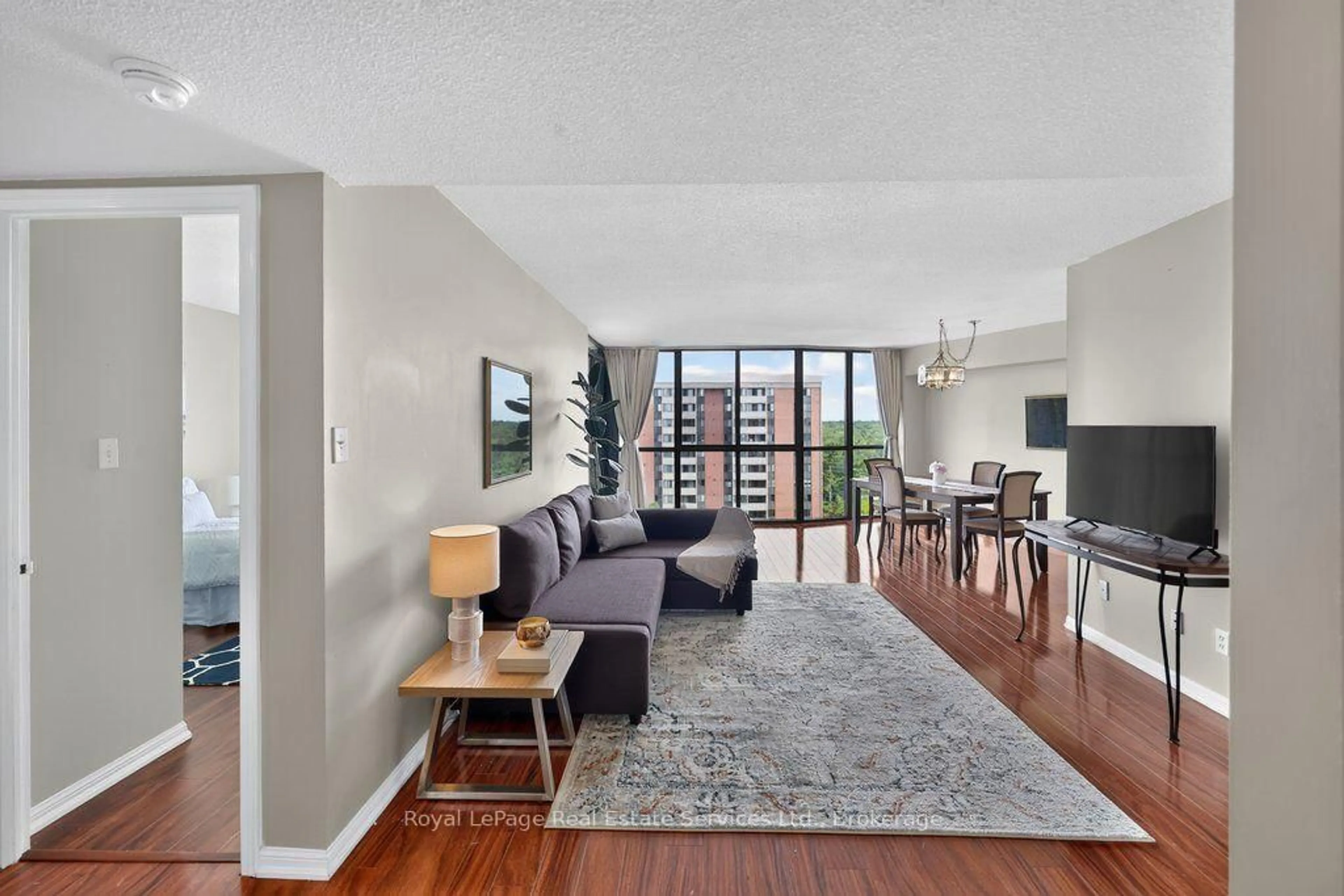 Living room with furniture, unknown for 1240 Marlborough Crt #1105, Oakville Ontario L6H 3K7