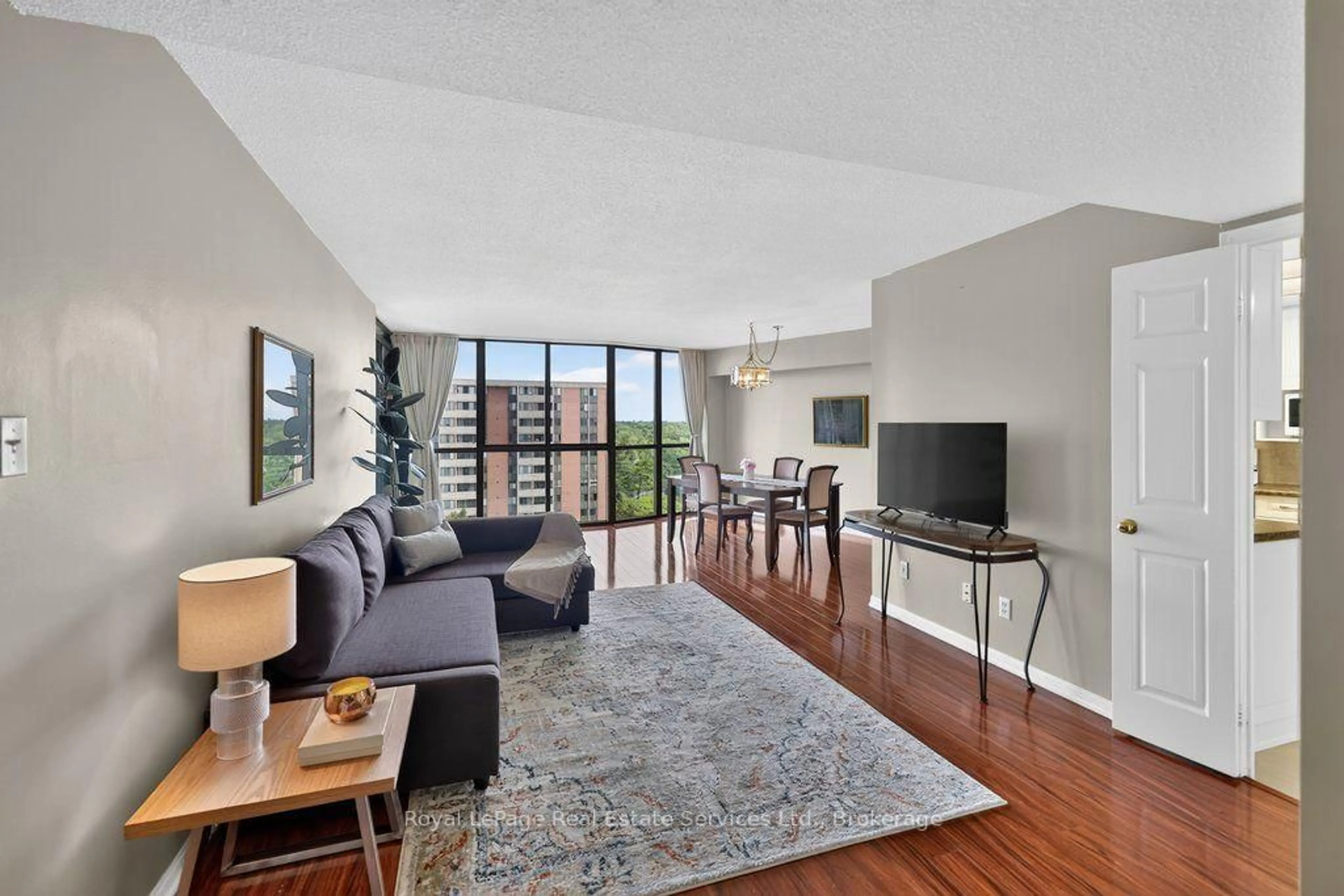 Living room with furniture, unknown for 1240 Marlborough Crt #1105, Oakville Ontario L6H 3K7