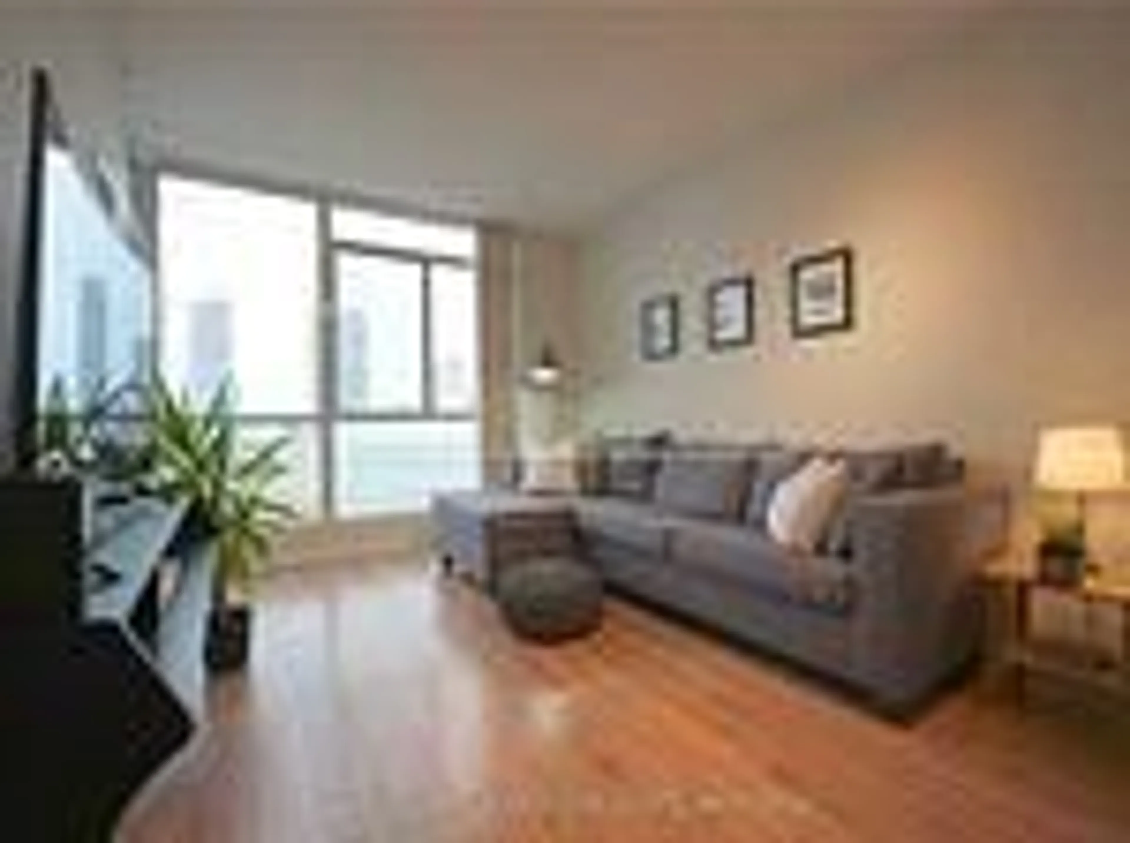 Living room with furniture, wood/laminate floor for 225 Webb Dr #3410, Mississauga Ontario L5B 4P2
