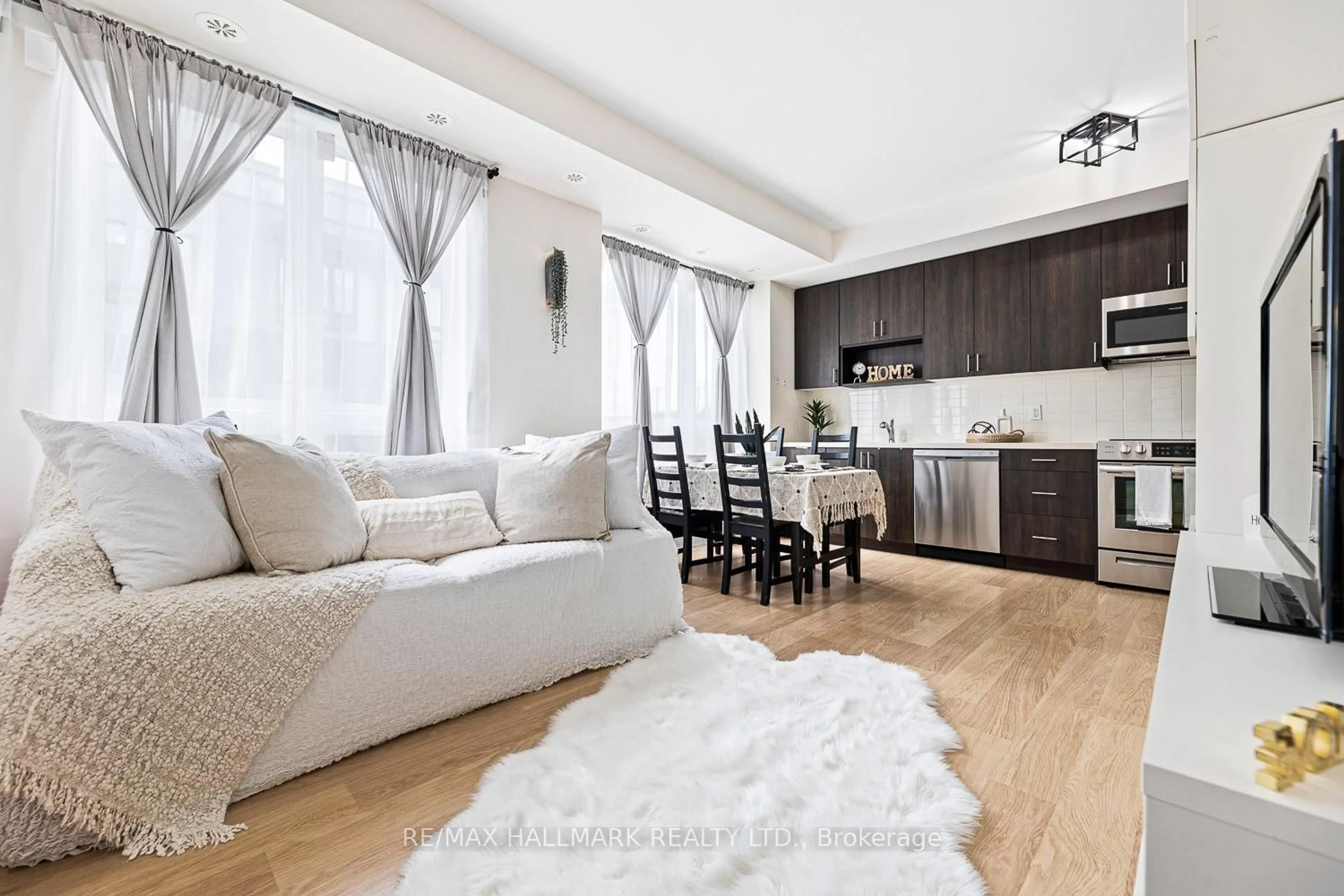 Living room with furniture, unknown for 1120 Briar Hill Ave #306, Toronto Ontario M6B 0A9