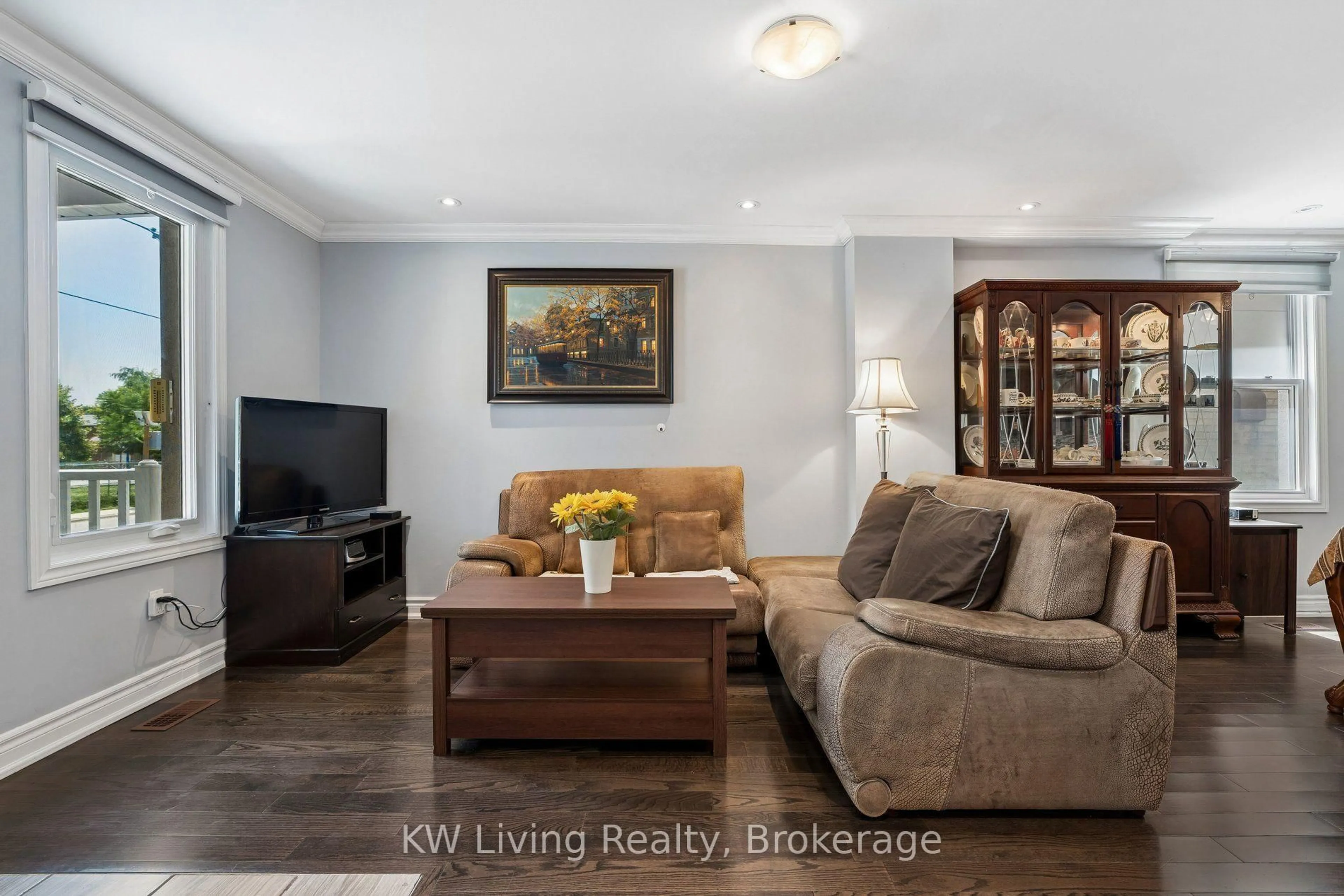 Living room with furniture, wood/laminate floor for 116 Seventh St, Toronto Ontario M8V 3B4