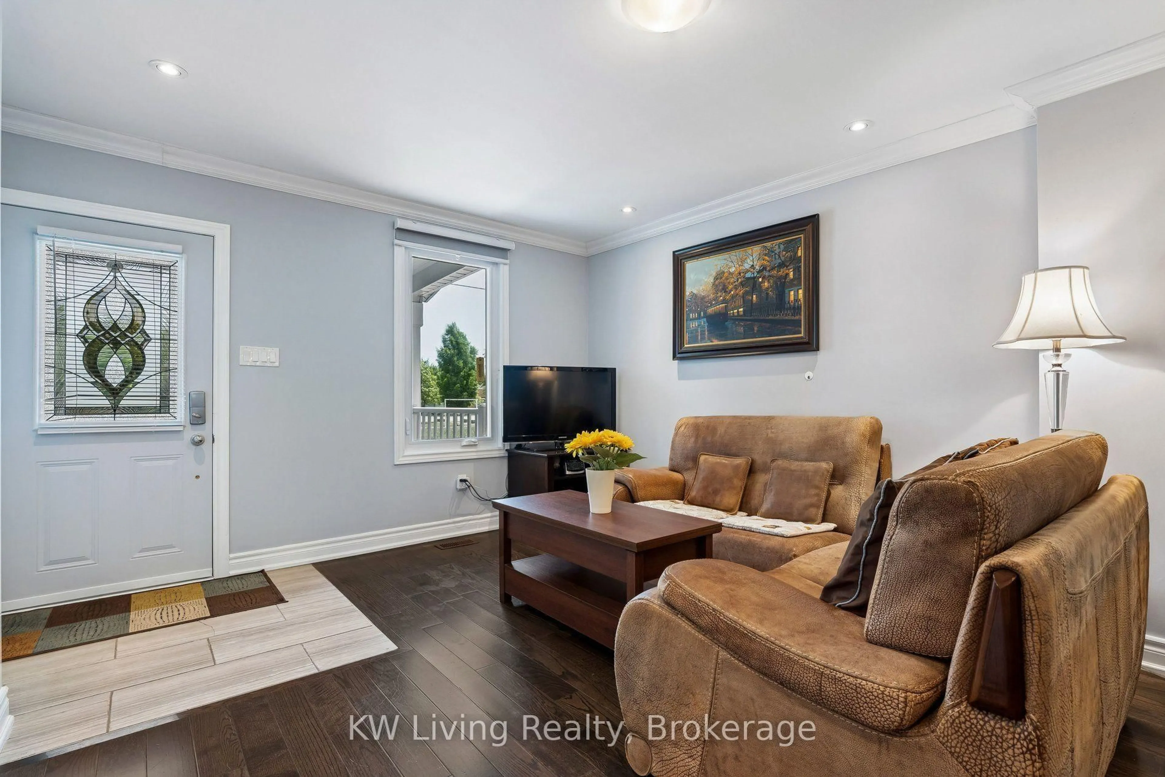 Living room with furniture, wood/laminate floor for 116 Seventh St, Toronto Ontario M8V 3B4