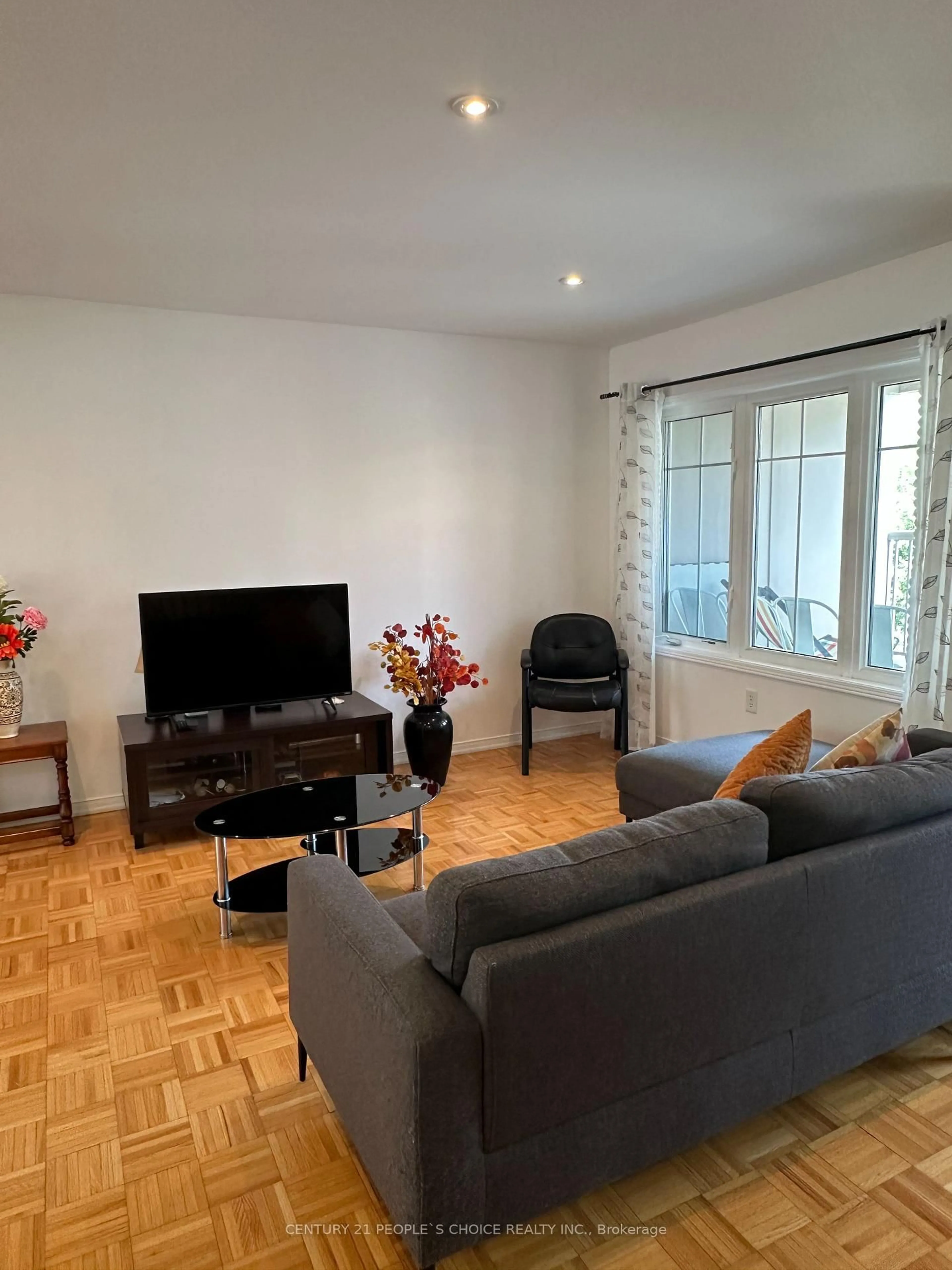 Living room with furniture, wood/laminate floor for 375 Cook Rd #3, Toronto Ontario M3J 3T6