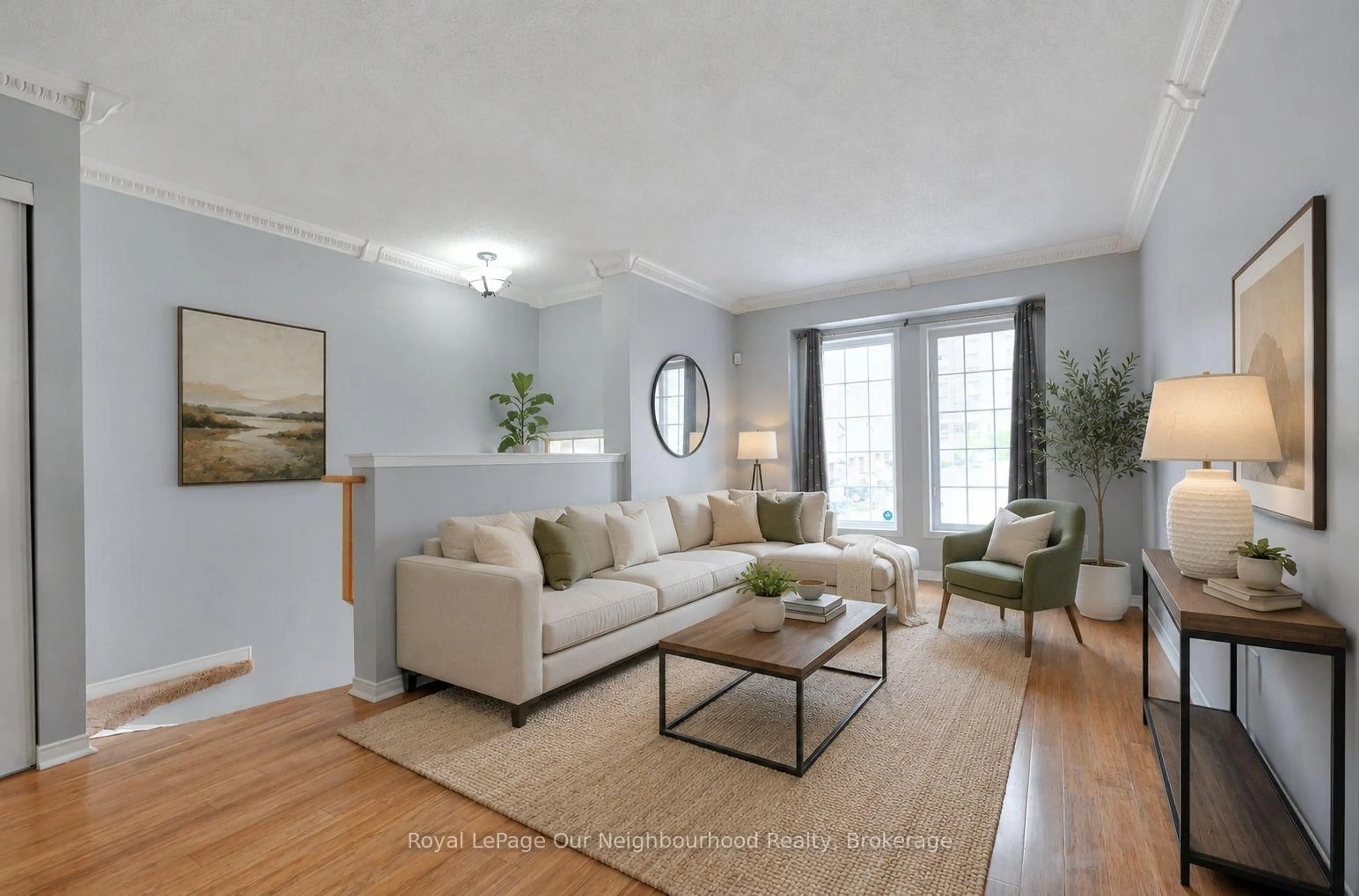 Living room with furniture, wood/laminate floor for 50 Strathaven Dr #96, Mississauga Ontario L5R 4E7
