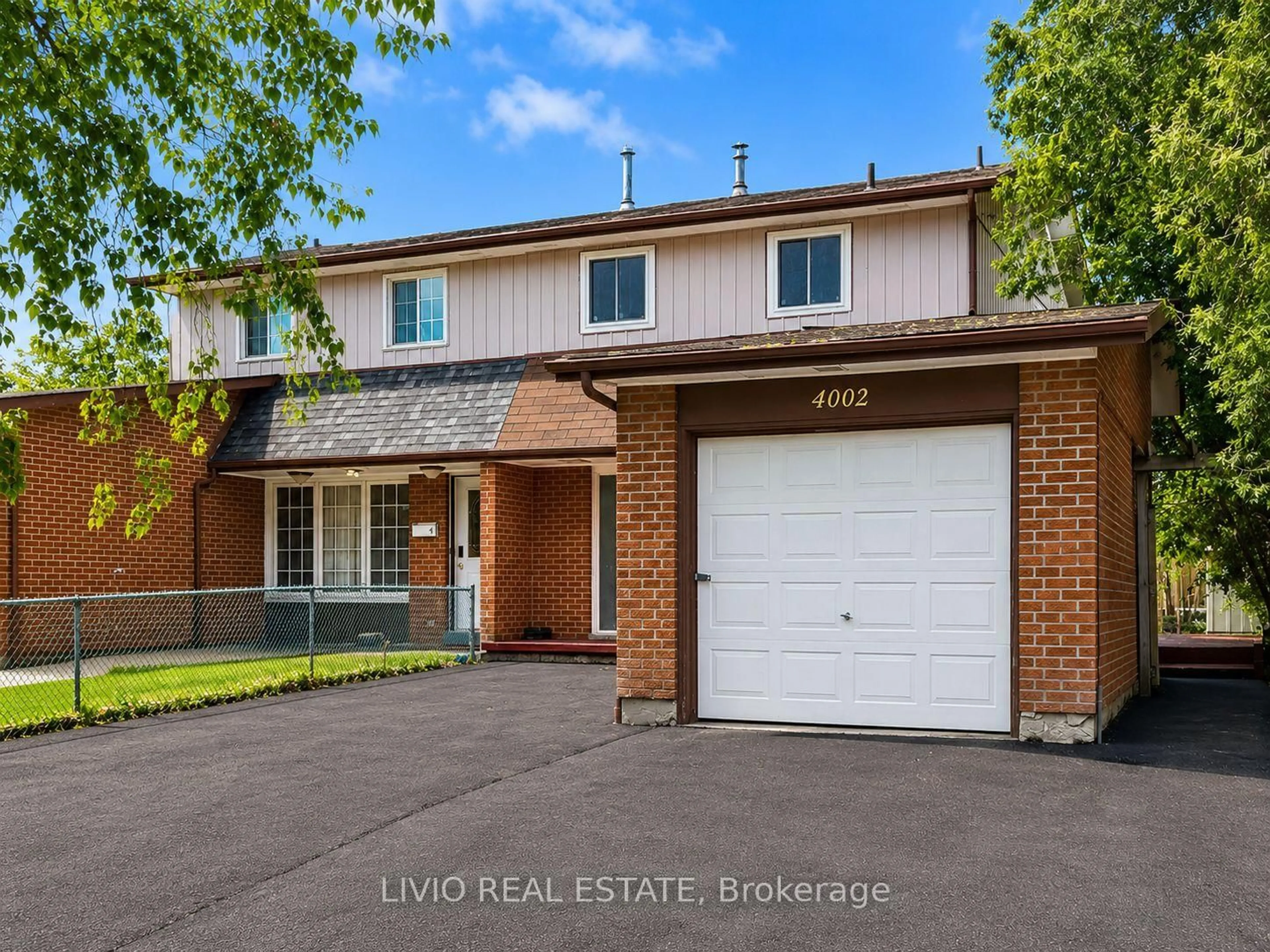 Home with brick exterior material, street for 4002 Brandon Gate Dr, Mississauga Ontario L4T 3N4