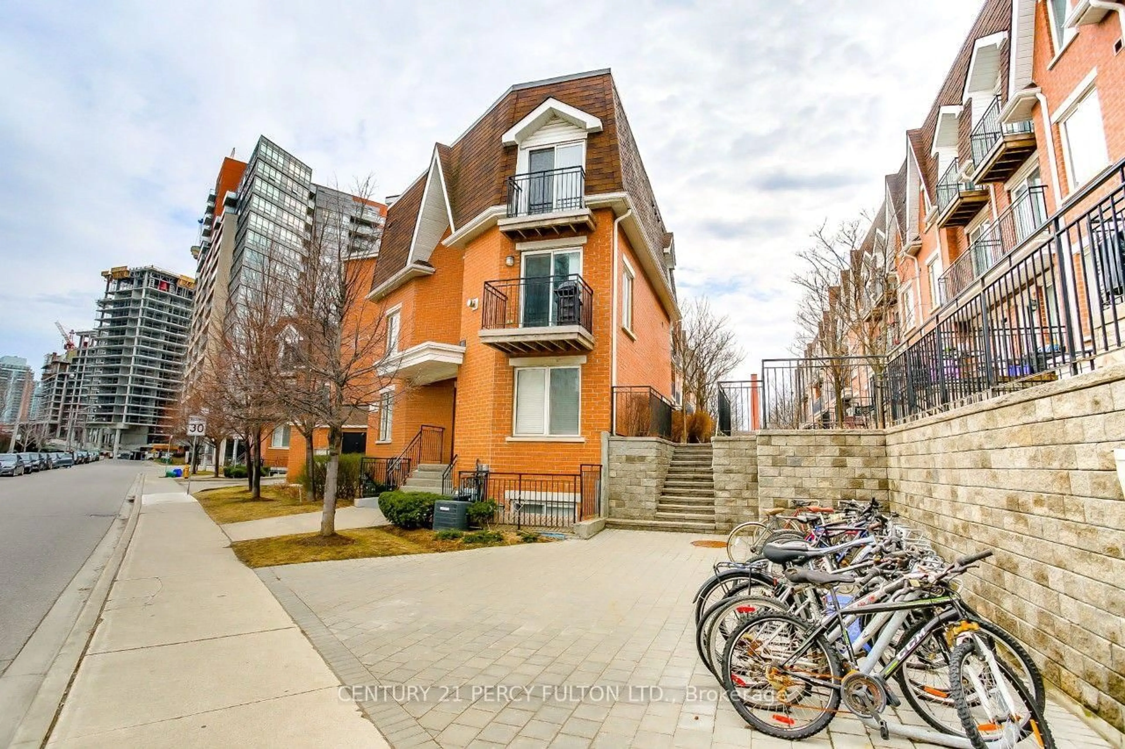 Home with brick exterior material, street for 20 Machells Ave #112, Toronto Ontario M6K 3H8