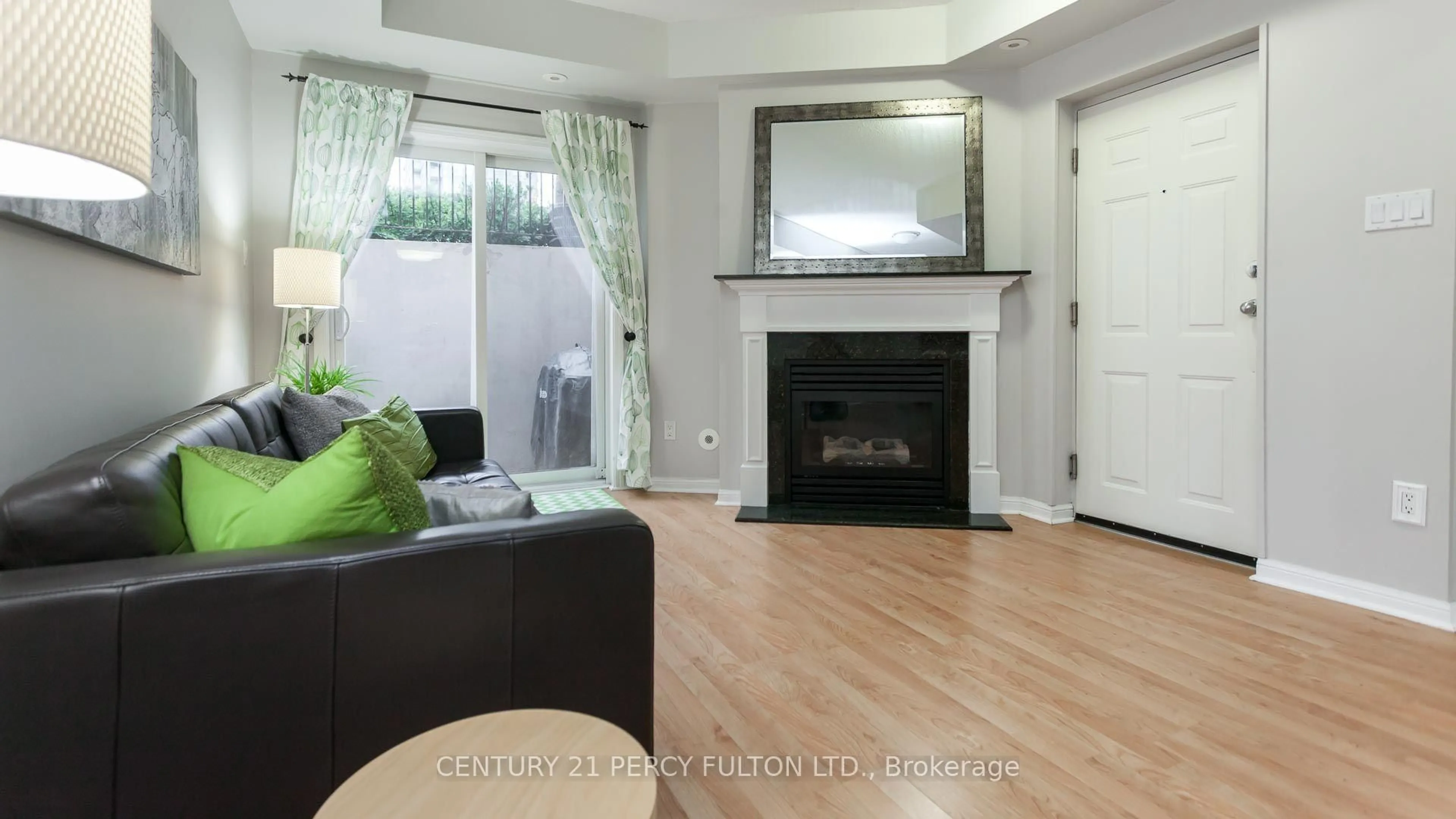 Living room with furniture, wood/laminate floor for 20 Machells Ave #112, Toronto Ontario M6K 3H8
