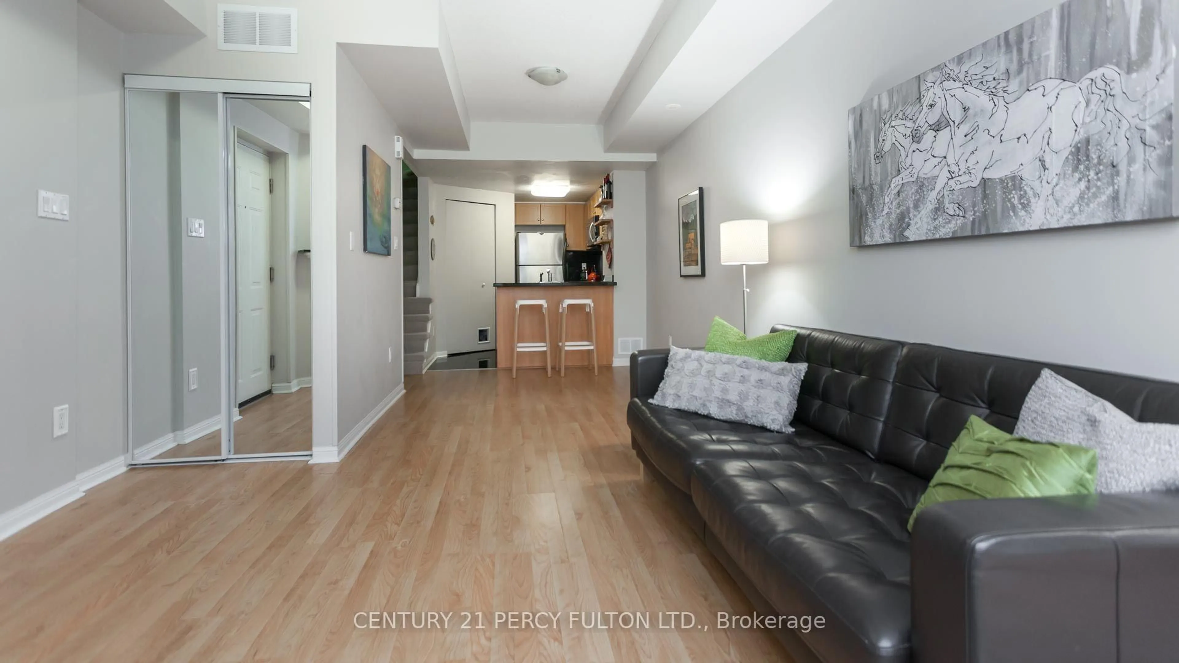 Living room with furniture, wood/laminate floor for 20 Machells Ave #112, Toronto Ontario M6K 3H8