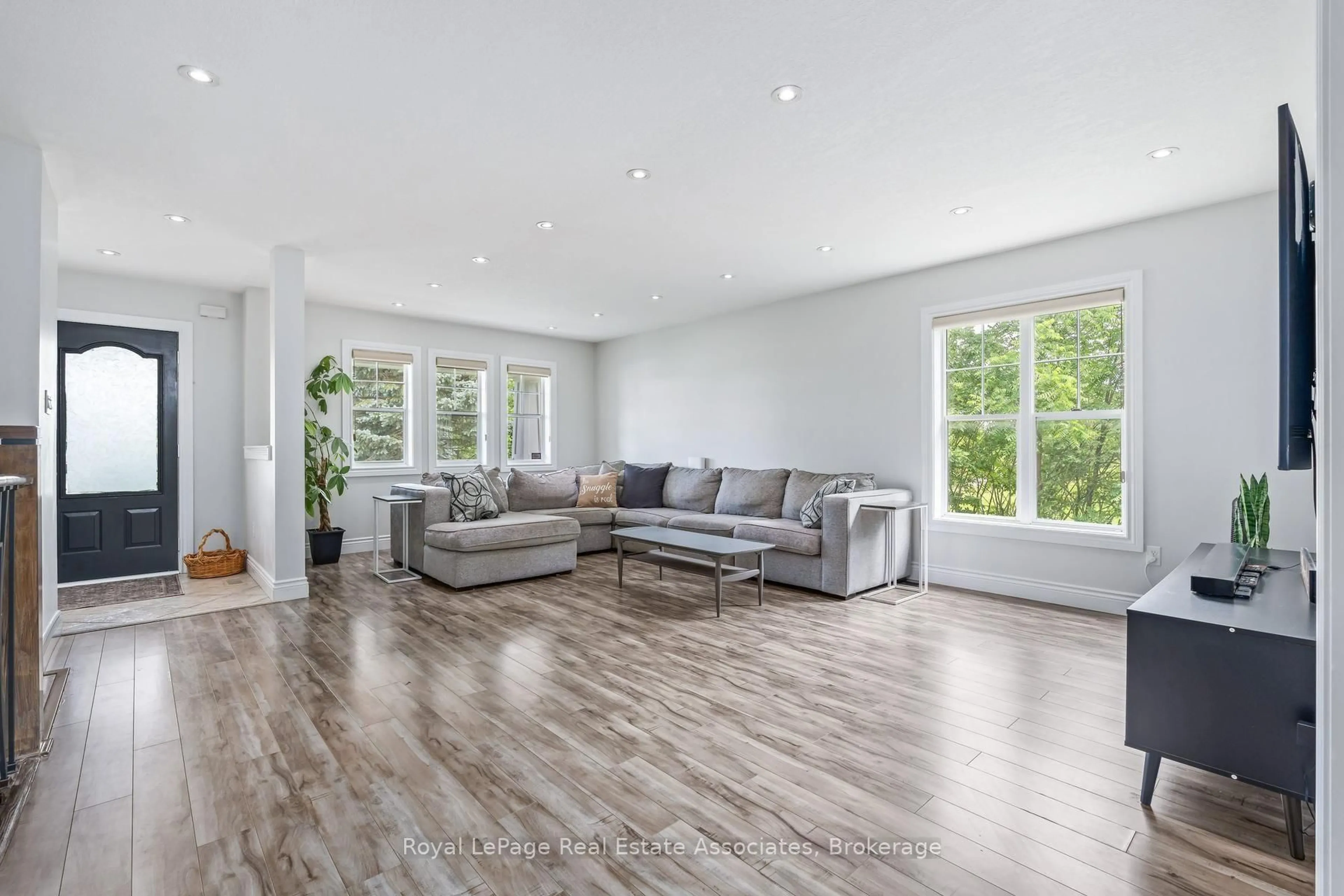 Living room with furniture, wood/laminate floor for 62 Somerville Rd, Halton Hills Ontario L7J 2Z7