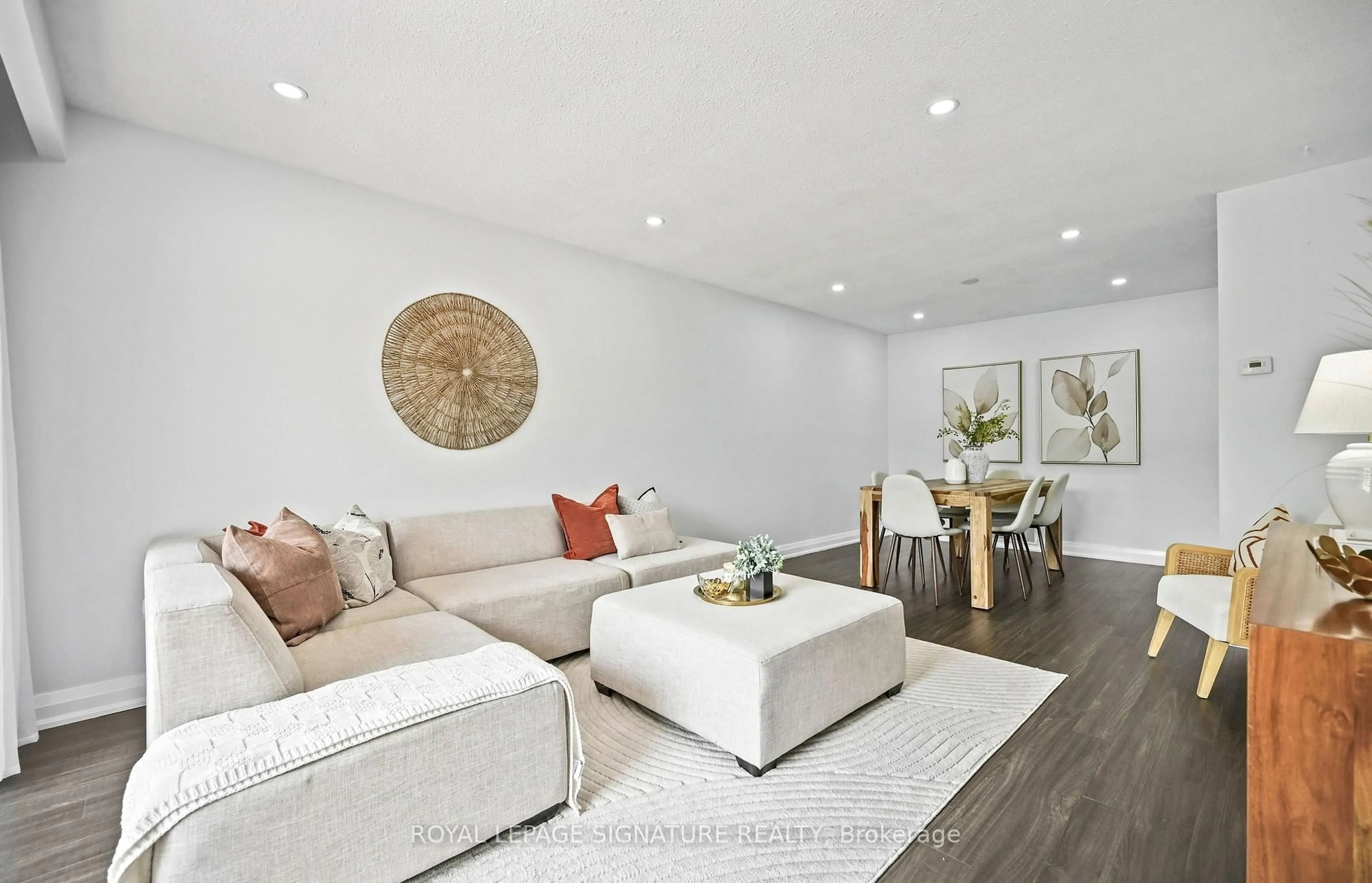 Living room with furniture, wood/laminate floor for 23 Abell Dr, Brampton Ontario L5V 2W1