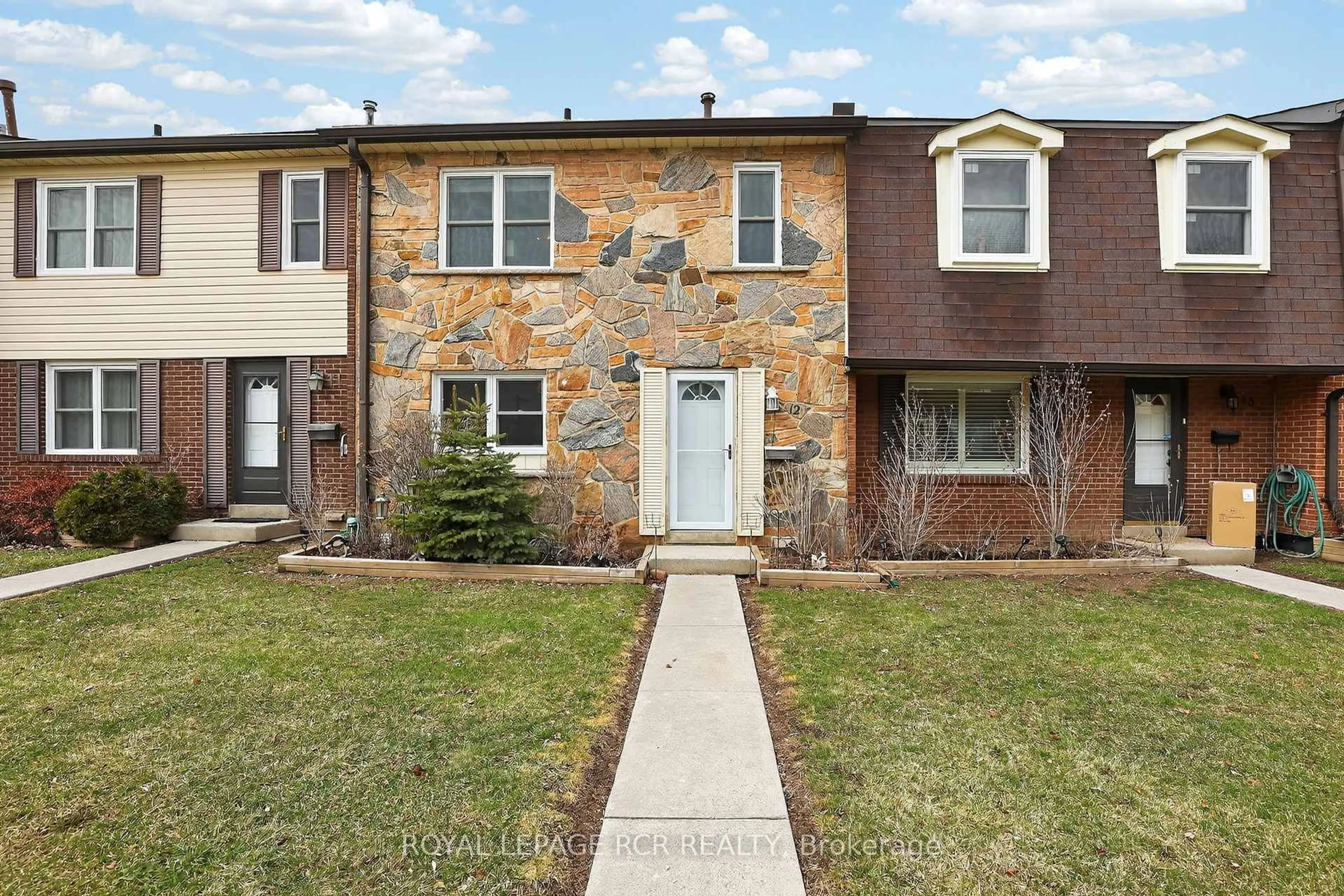 Home with brick exterior material, street for 2825 Gananoque Dr #12, Mississauga Ontario L5N 1V6