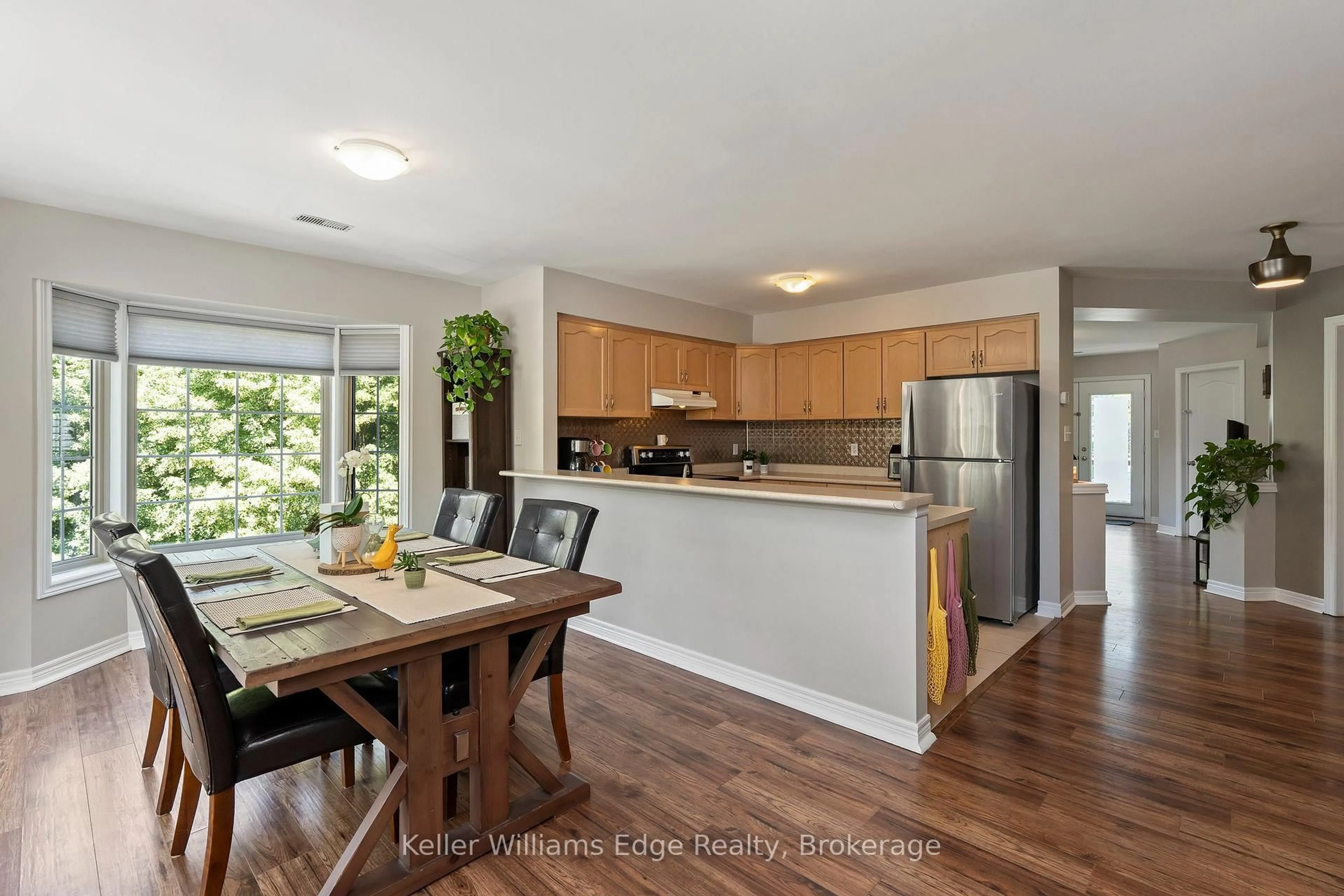 Open concept kitchen, wood/laminate floor for 705 Cumberland Ave #8, Burlington Ontario L7N 3W4