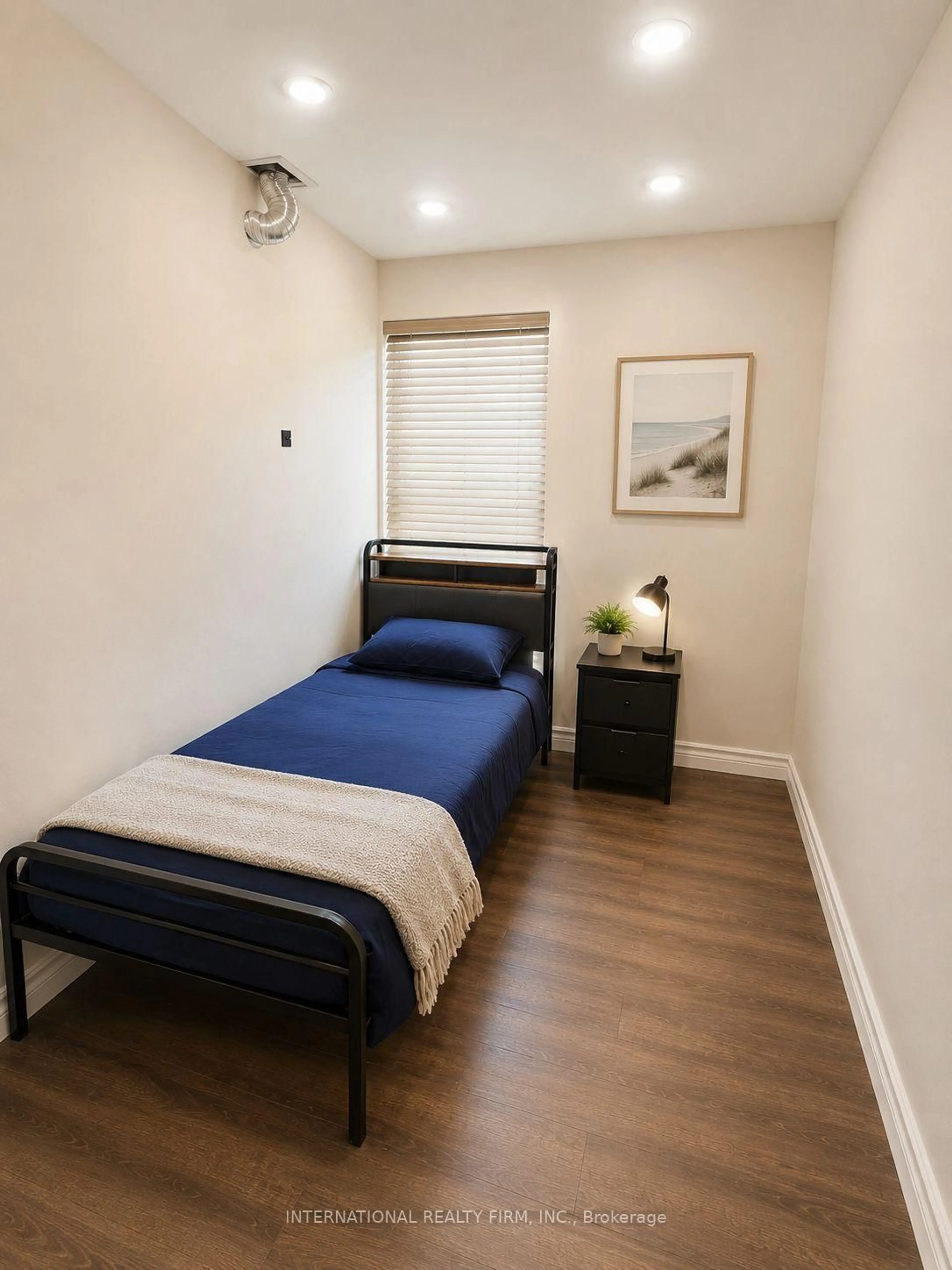 Bedroom with bed, wood/laminate floor for 36 Ridge Rd, Toronto Ontario M3M 1C7