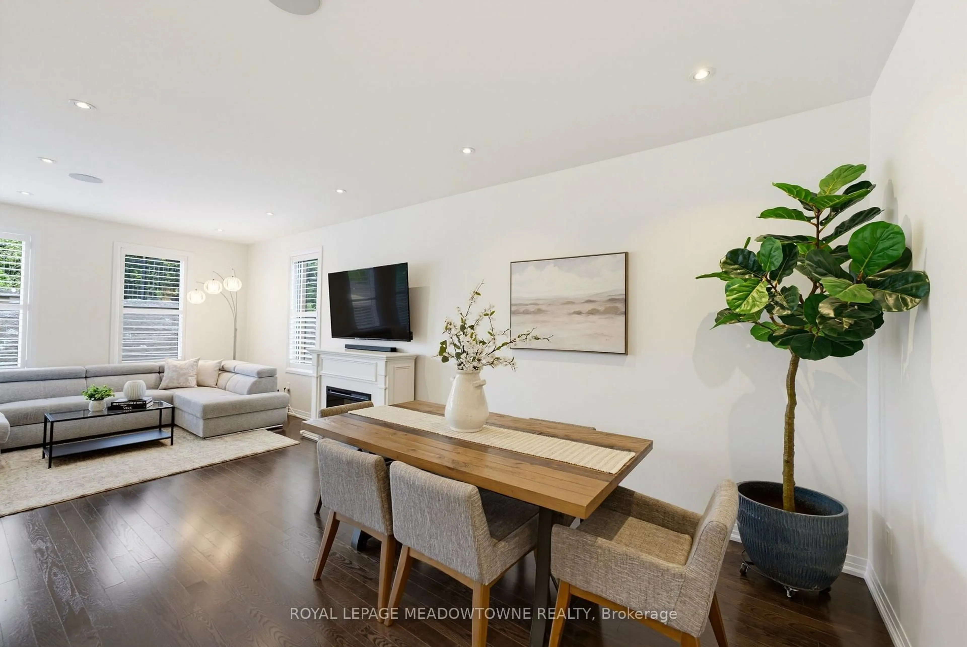 Living room with furniture, wood/laminate floor for 779 Banks Cres, Milton Ontario L9T 9A3