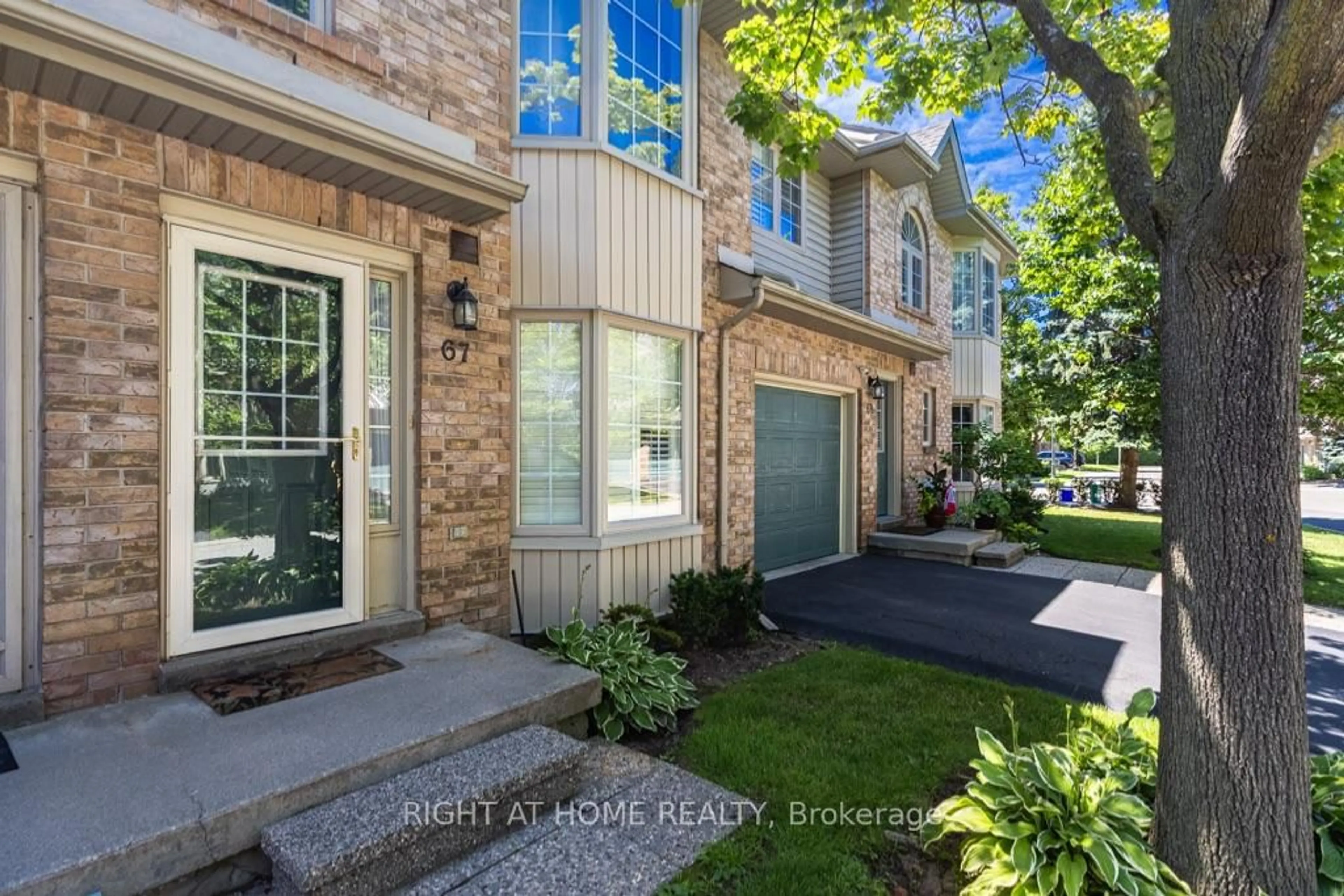 Home with brick exterior material, street for 3333 New St #67, Burlington Ontario L7N 1N1