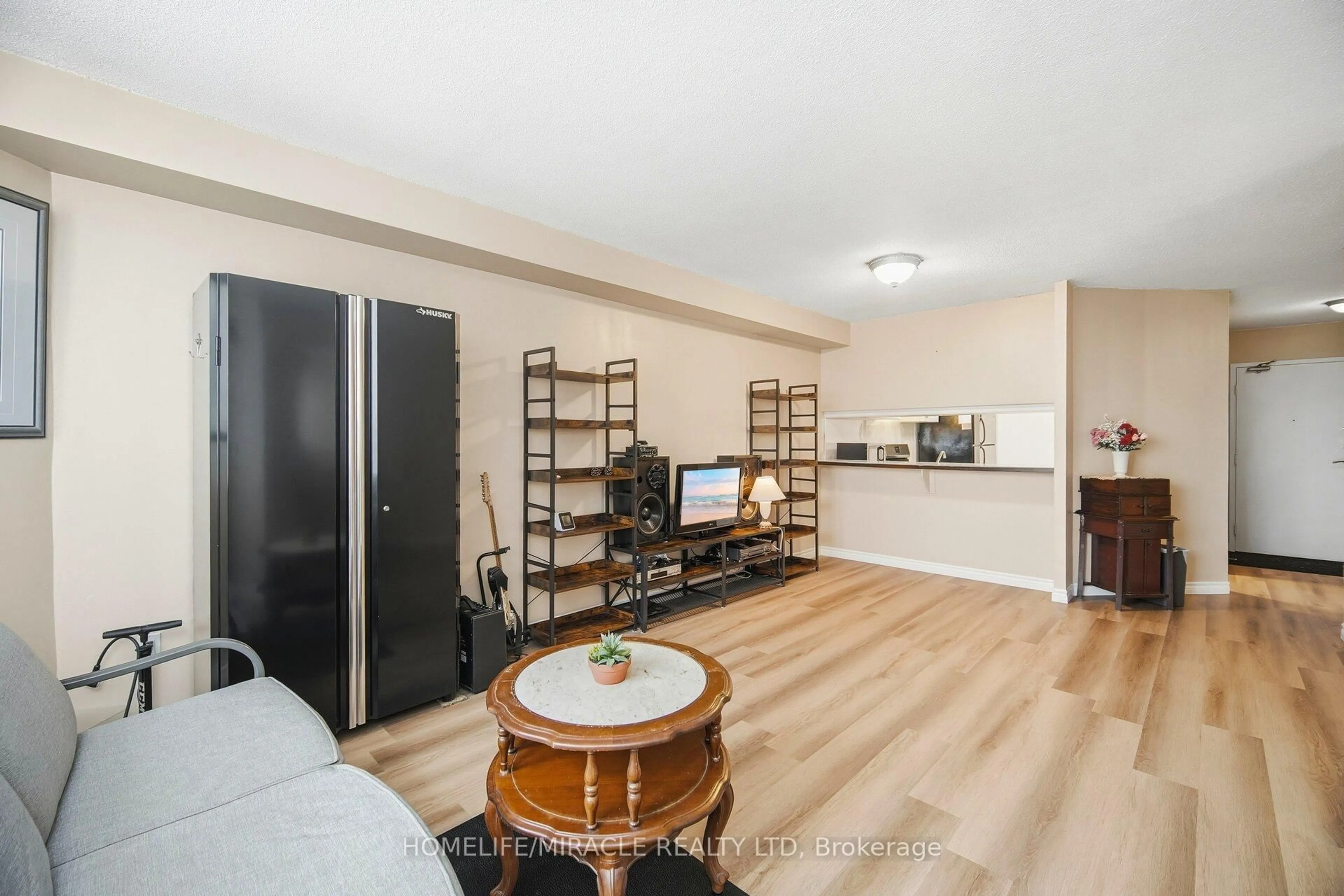 Living room with furniture, wood/laminate floor for 234 Albion Rd #610, Toronto Ontario M9W 6A5