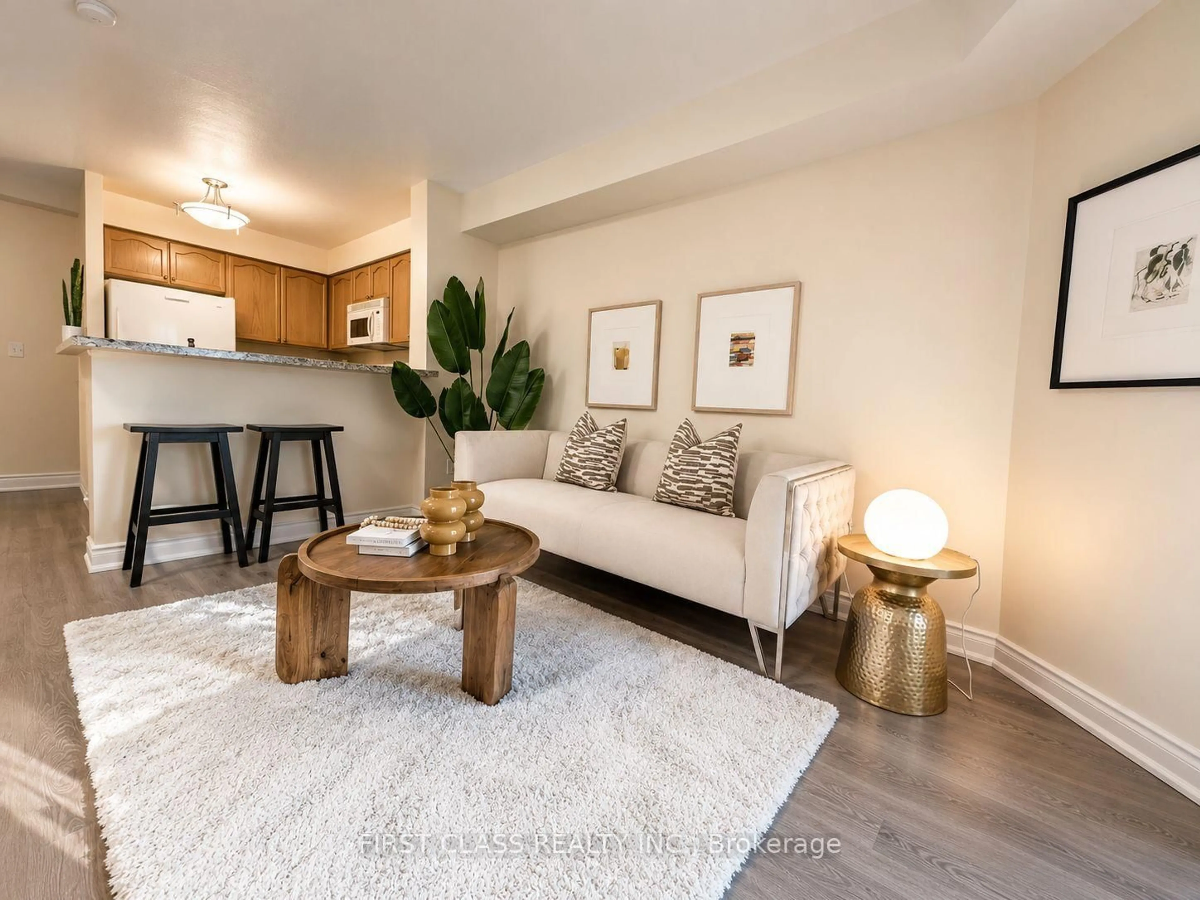 Living room with furniture, wood/laminate floor for 11 Michael Power Pl #715, Toronto Ontario M9A 5G3