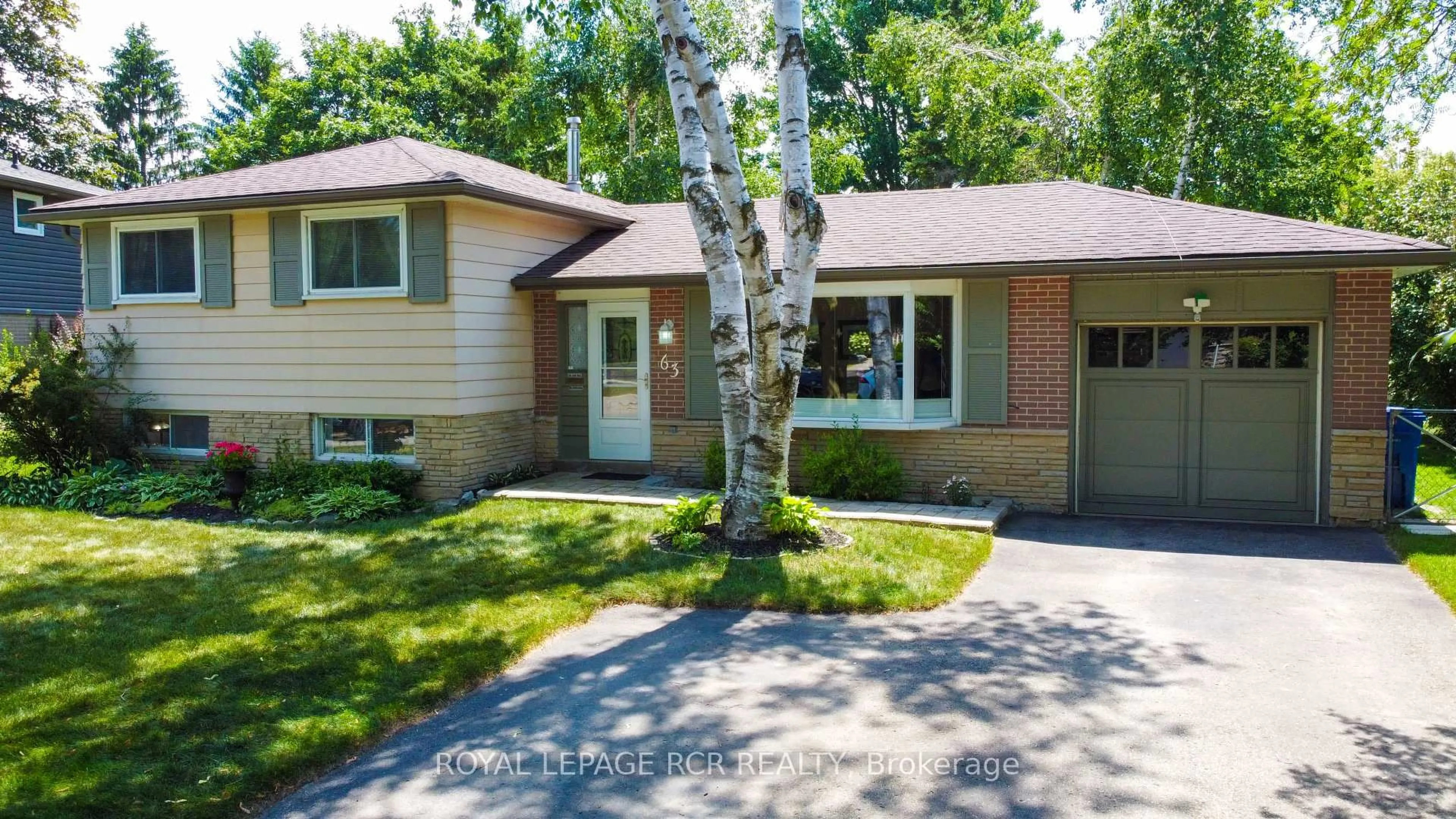 Home with vinyl exterior material, street for 63 Maple Cres, Orangeville Ontario L9W 1X6