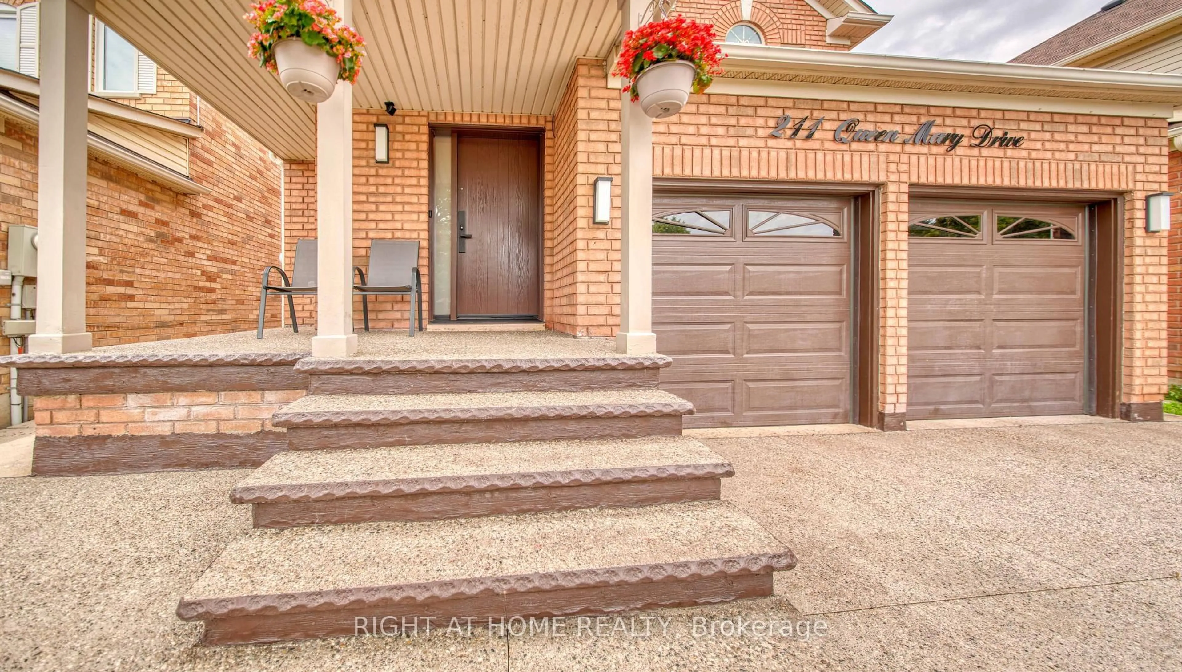 Home with brick exterior material, street for 211 Queen Mary Dr, Brampton Ontario L7A 1Y9