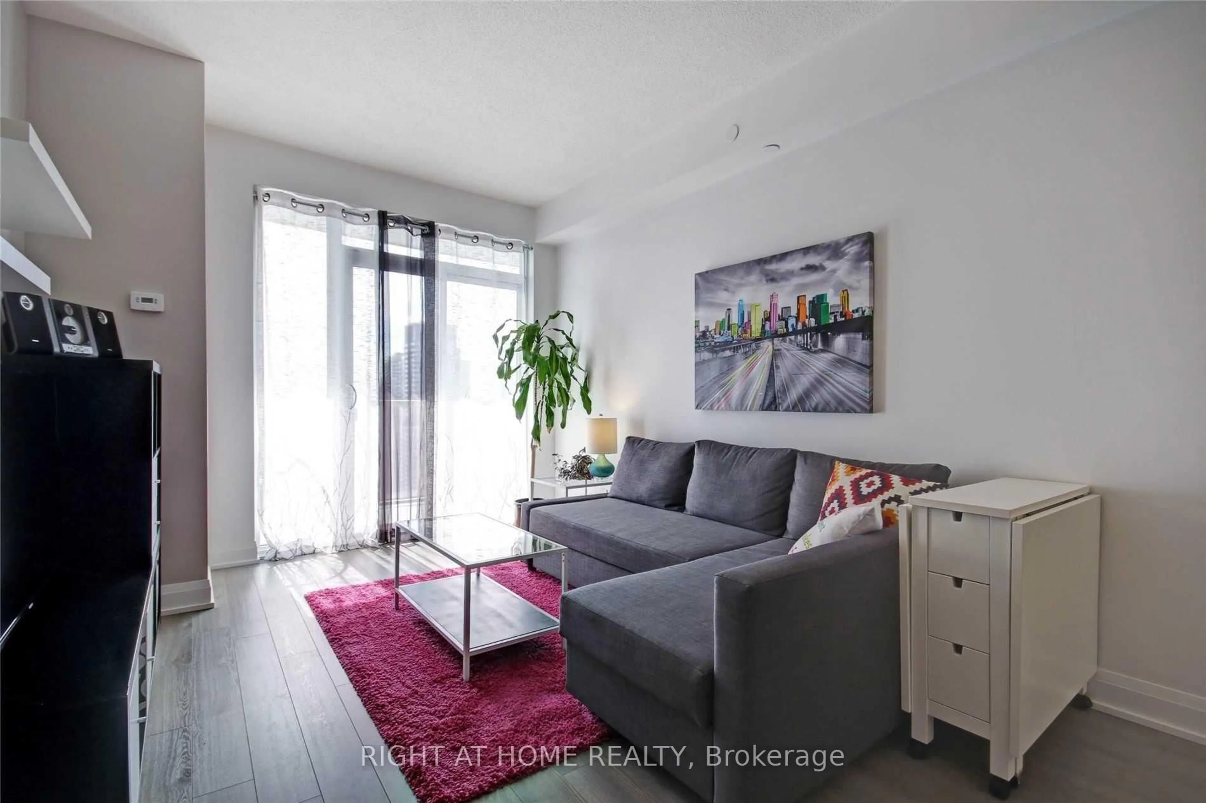 Living room with furniture, wood/laminate floor for 56 Annie Craig Dr #3204, Toronto Ontario M8V 0C5