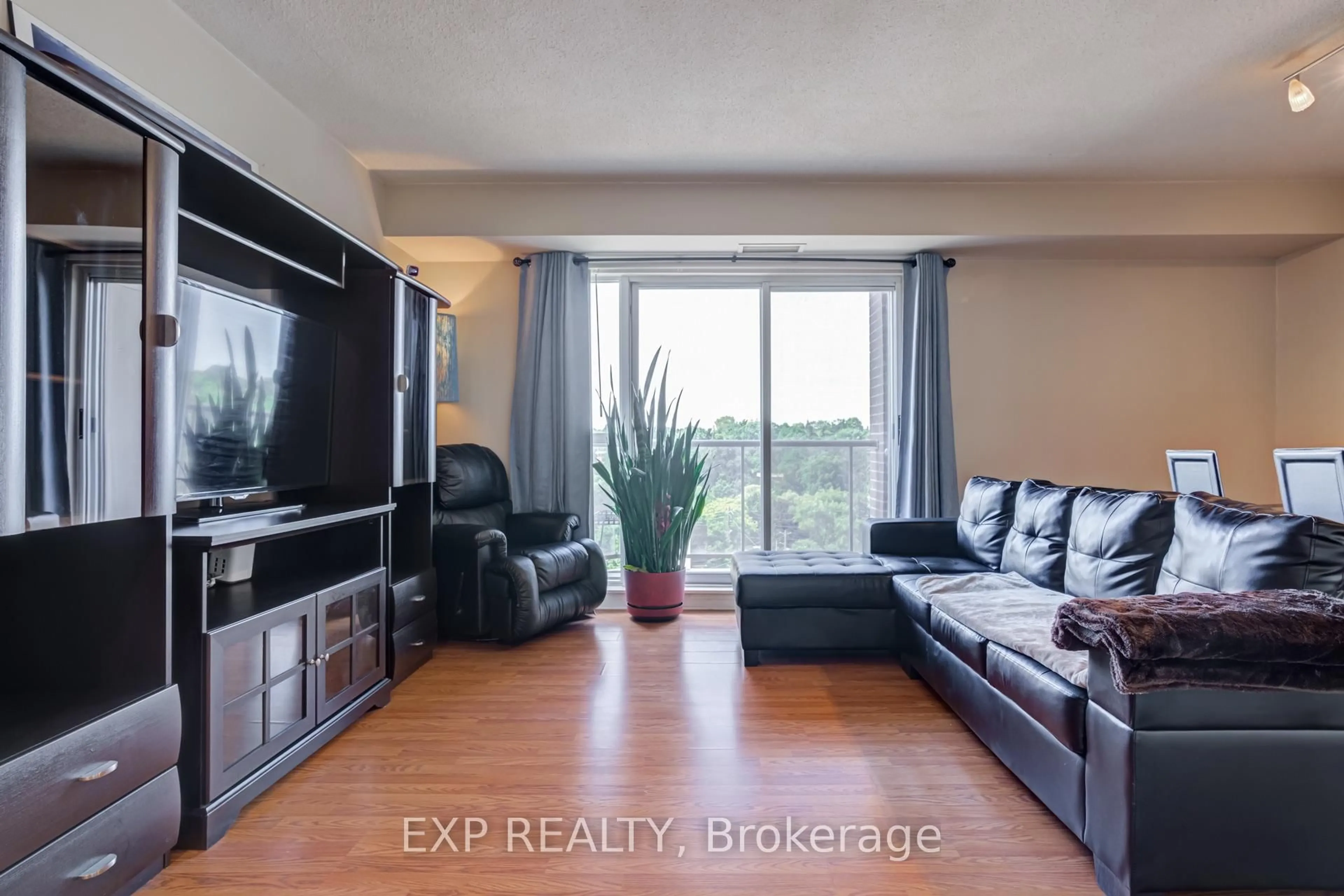 Living room with furniture, unknown for 2088 Lawrence Ave #707, Toronto Ontario M9N 3Z9