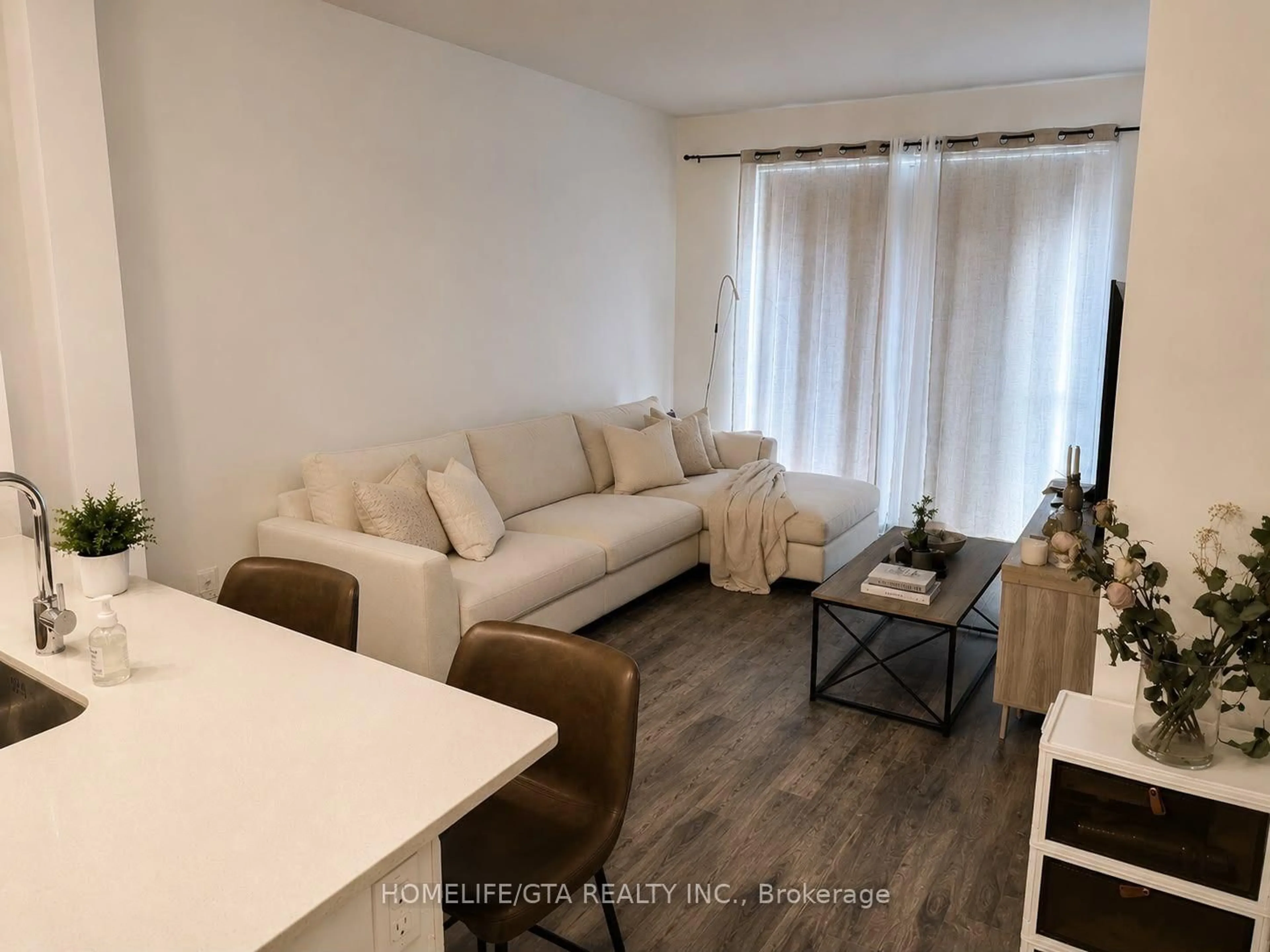 Living room with furniture, wood/laminate floor for 35 Watergarden Dr #1616, Mississauga Ontario M1S 0C2