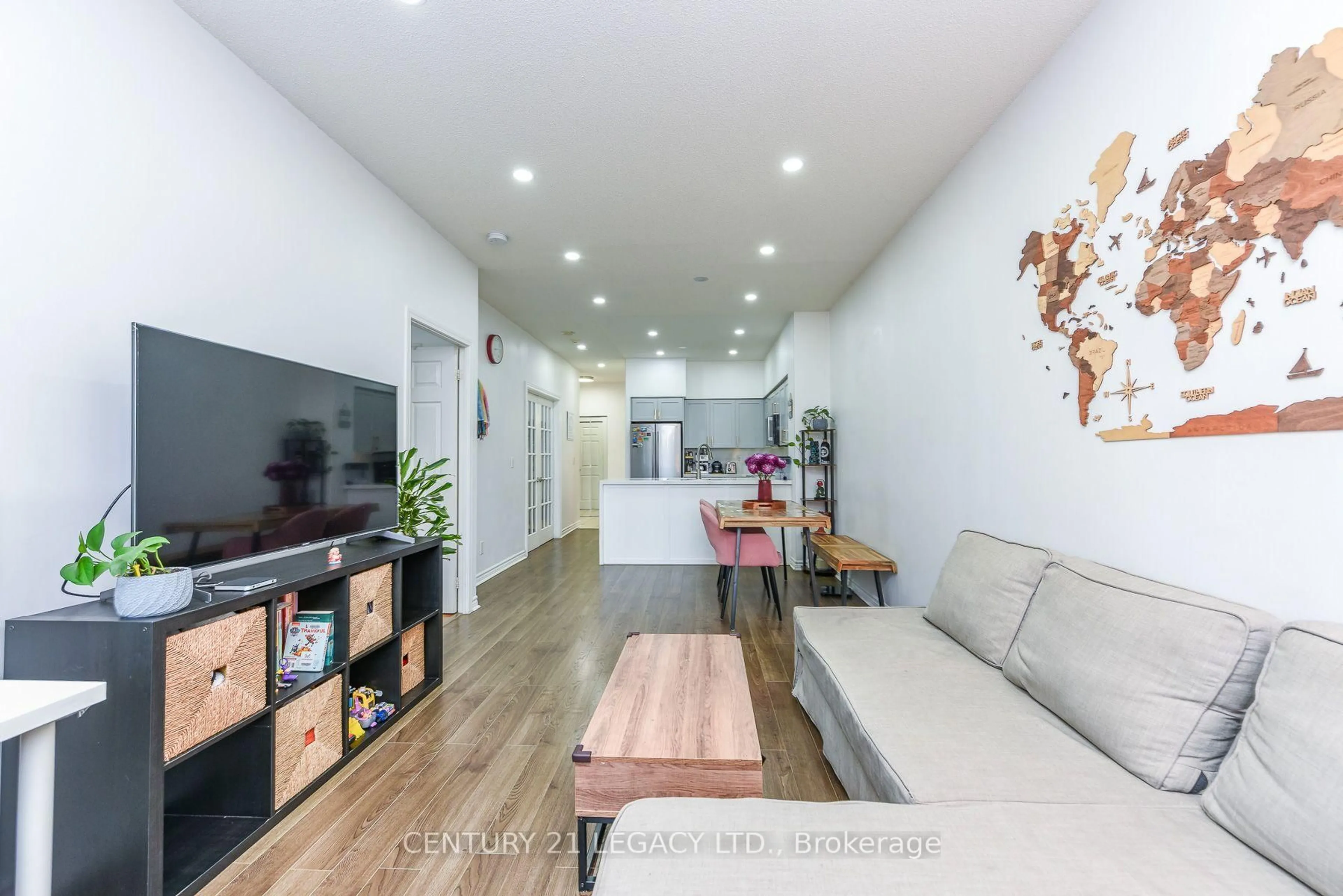 Living room with furniture, wood/laminate floor for 388 Prince Of Wales Dr #701, Mississauga Ontario L5B 0A1