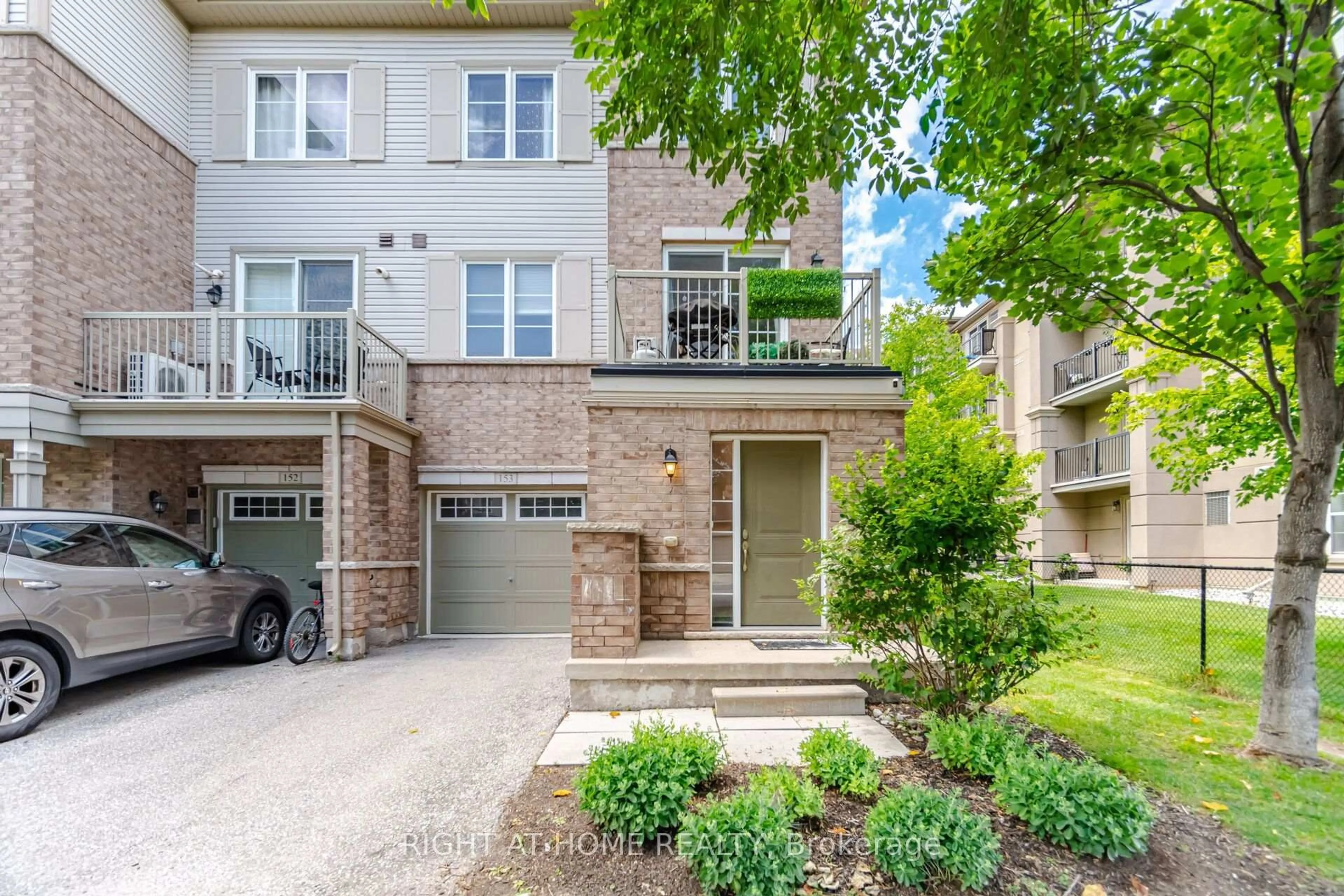 Home with brick exterior material, street for 165 Hampshire Way #153, Milton Ontario L9T 8M7