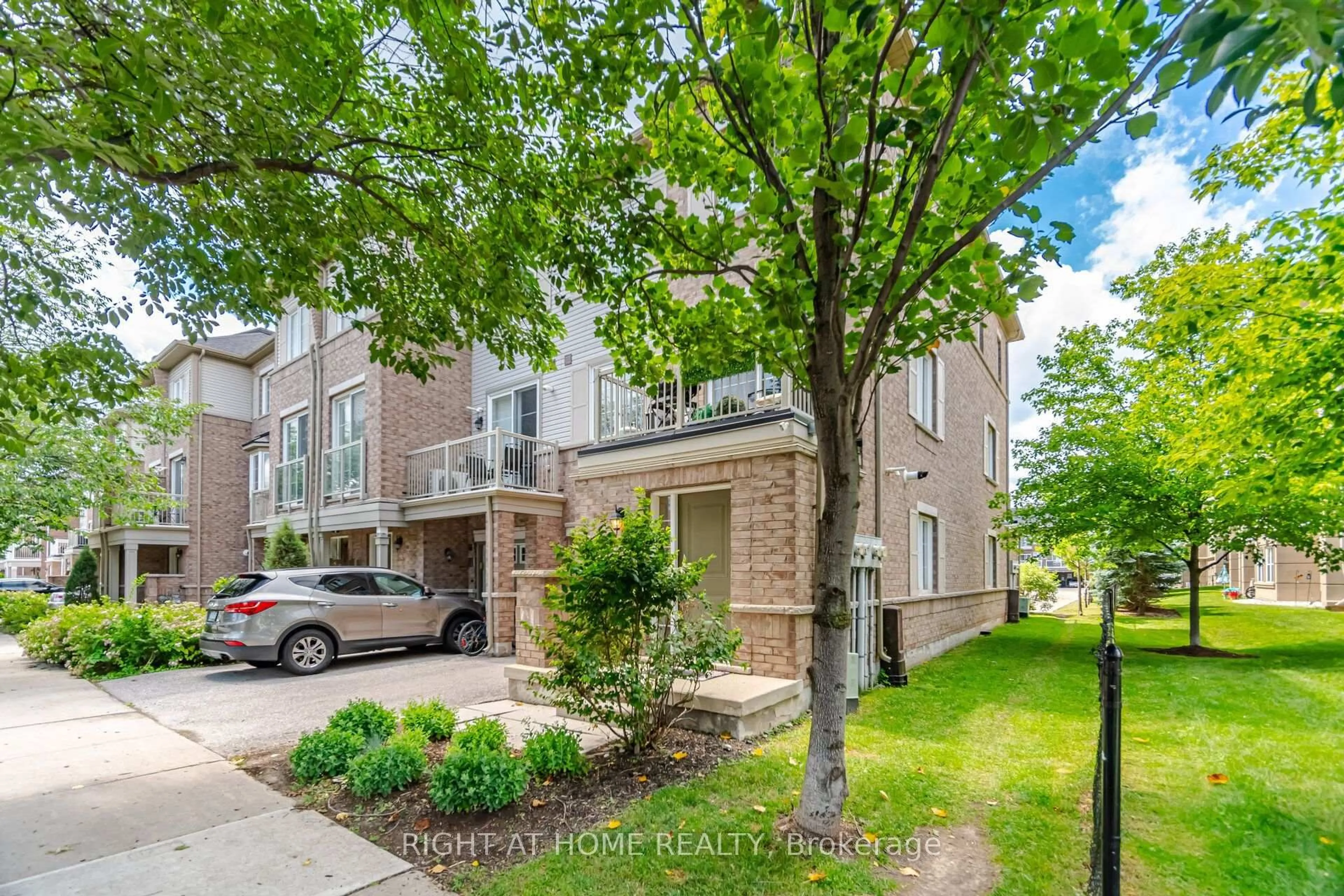 Home with brick exterior material, street for 165 Hampshire Way #153, Milton Ontario L9T 8M7