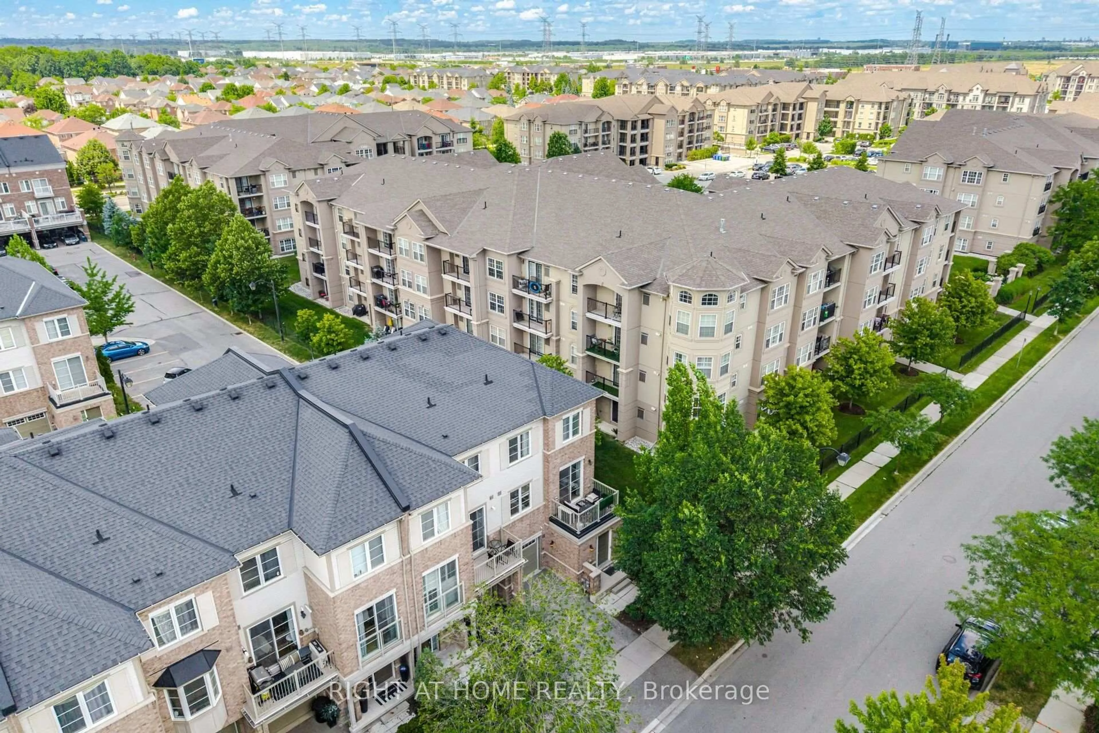 A pic from outside/outdoor area/front of a property/back of a property/a pic from drone, city buildings view from balcony for 165 Hampshire Way #153, Milton Ontario L9T 8M7