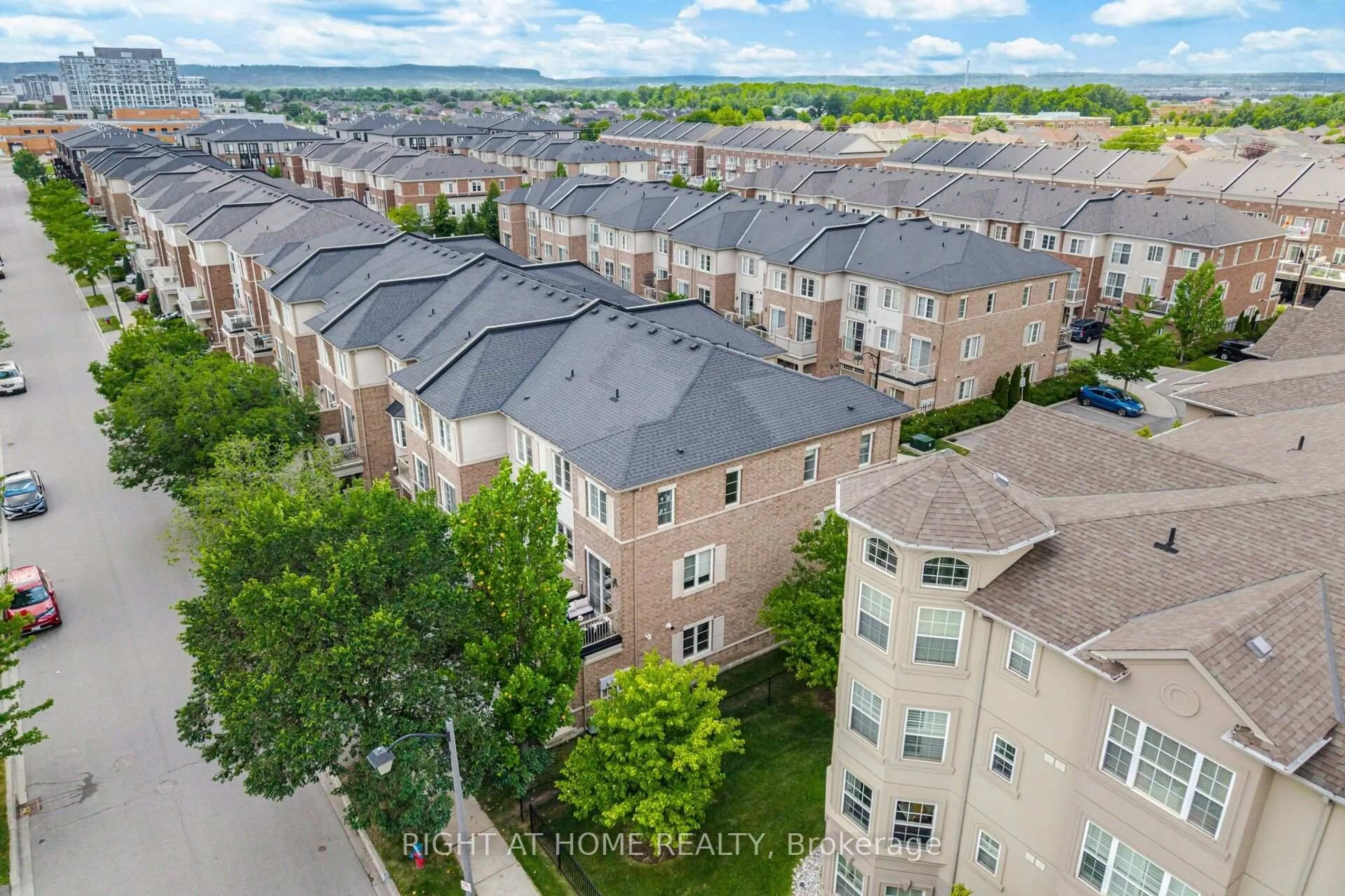A pic from outside/outdoor area/front of a property/back of a property/a pic from drone, city buildings view from balcony for 165 Hampshire Way #153, Milton Ontario L9T 8M7