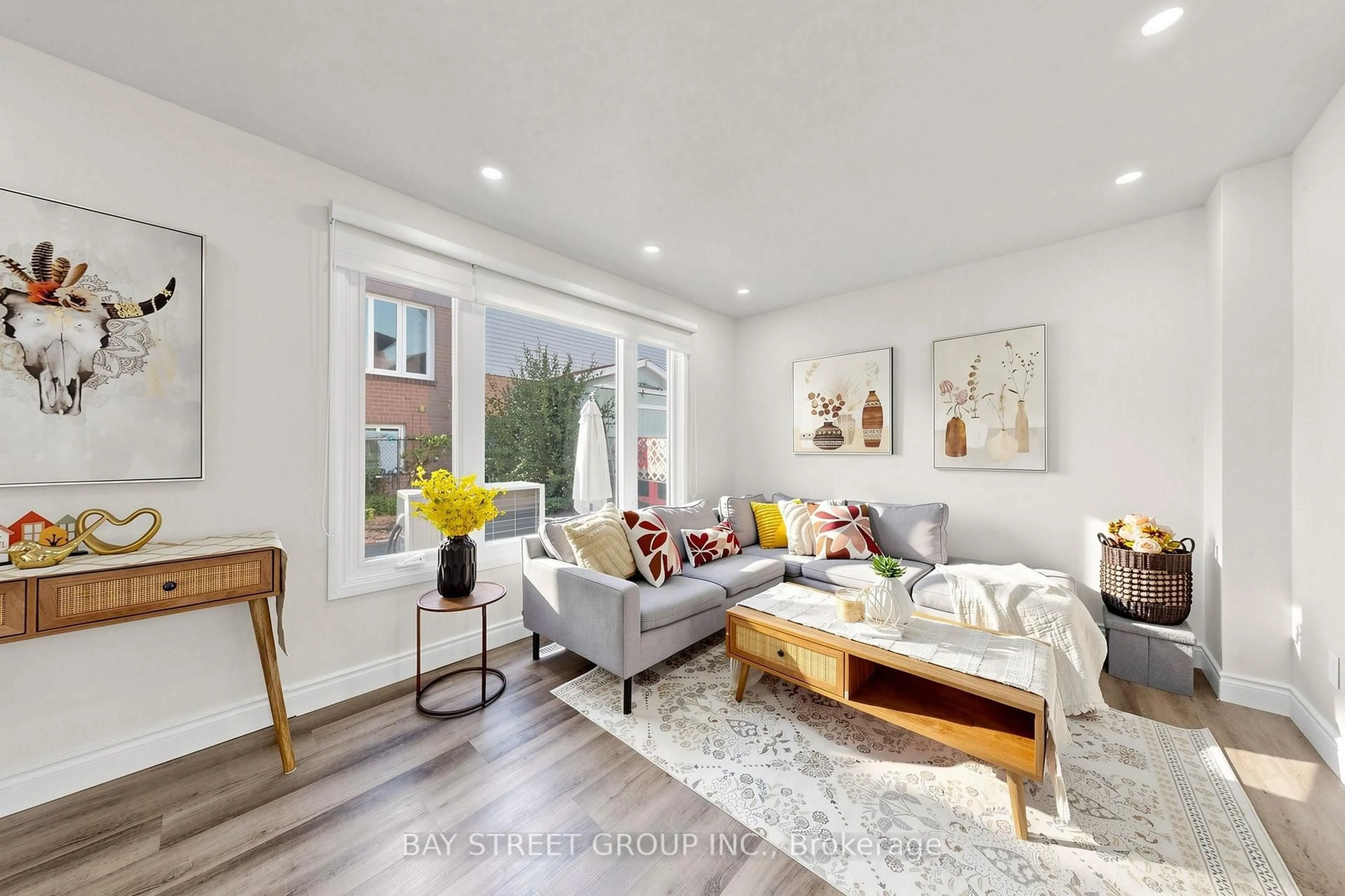 Living room with furniture, wood/laminate floor for 10 Peelton Heights Rd, Brampton Ontario L6Y 2J2