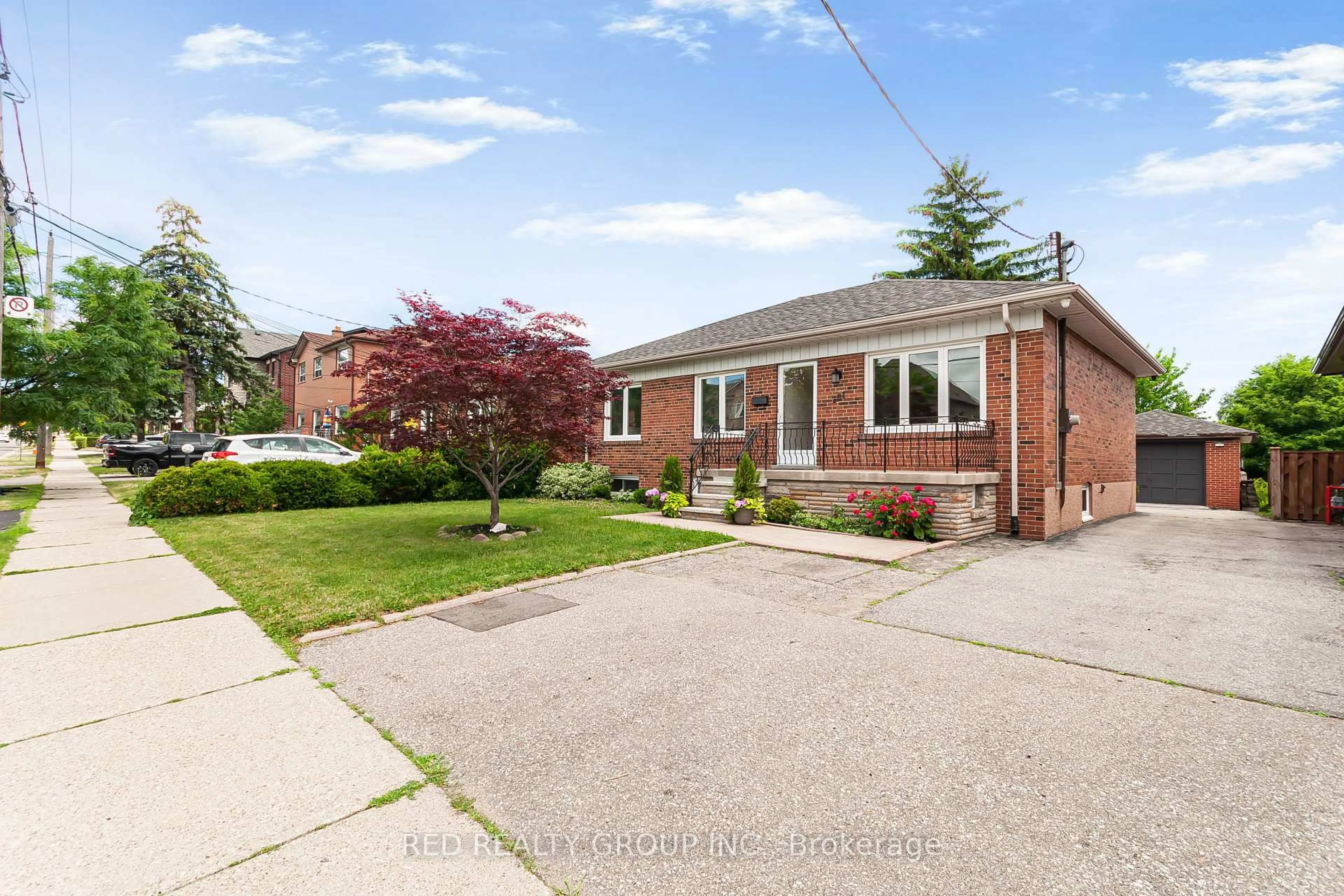 Home with brick exterior material, street for 281 Falstaff Ave, Toronto Ontario M6L 2G4